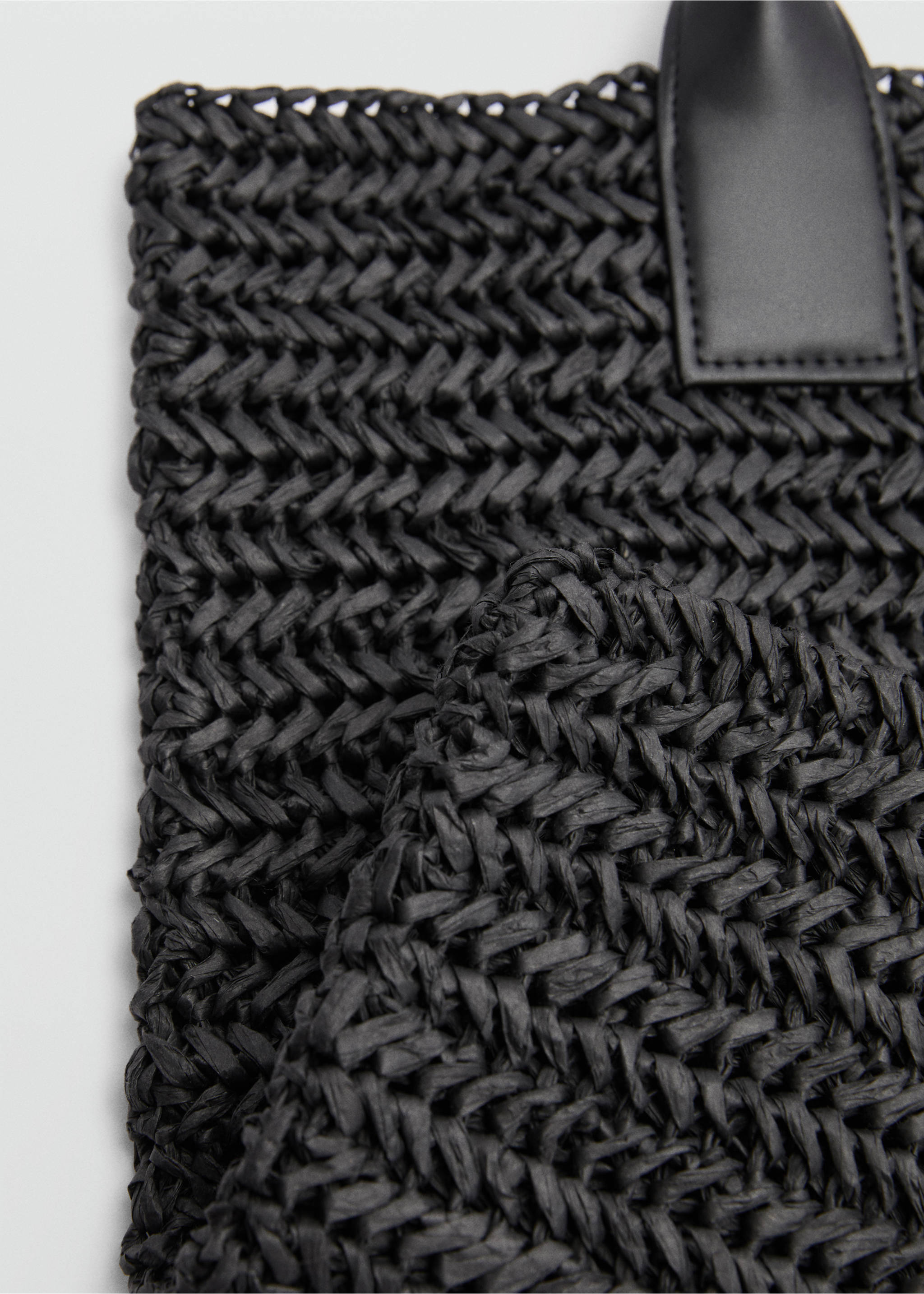 Black woven straw tote bag close-up showing texture, Black. Ref: 77050349-00.