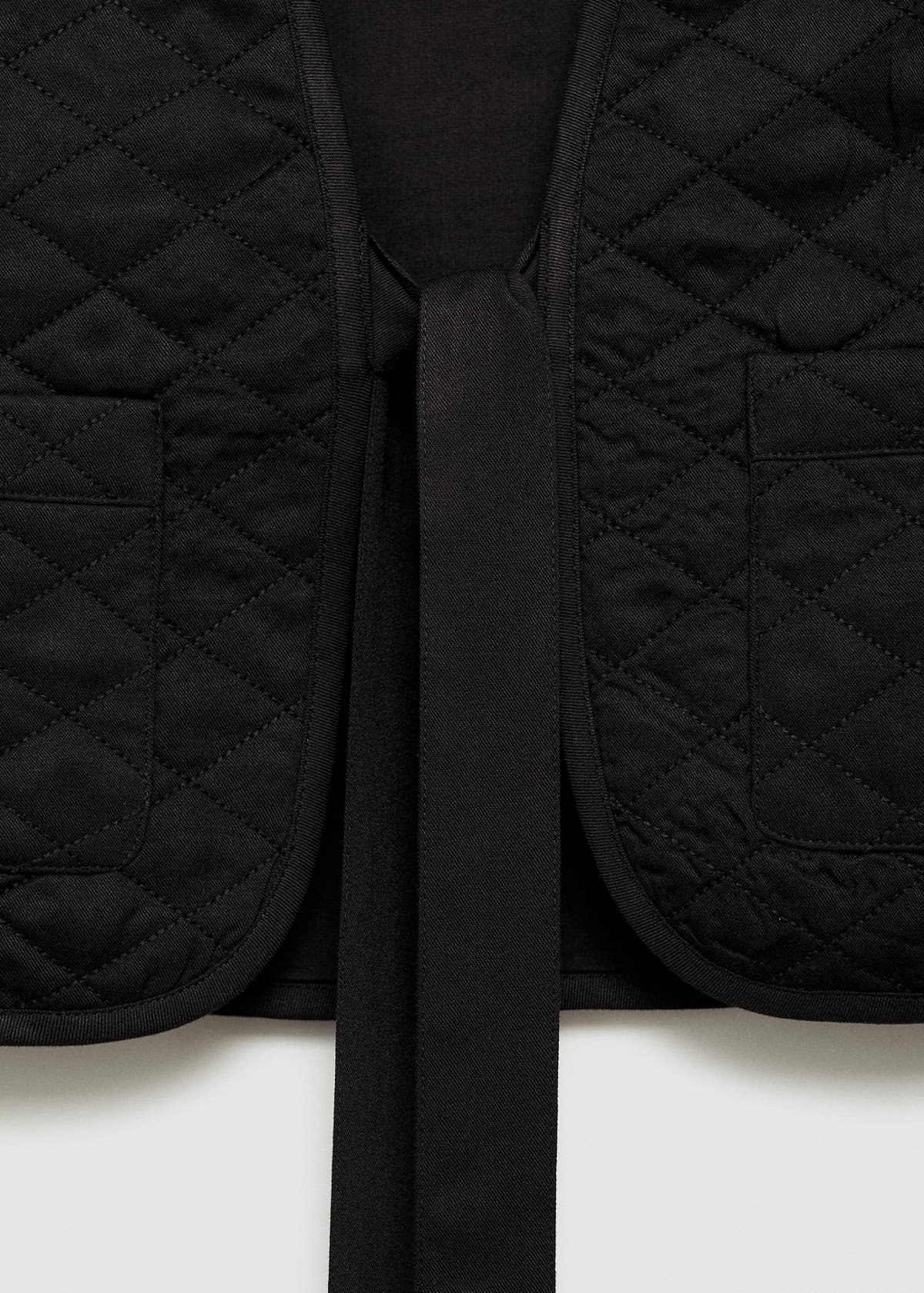 Quilted gilet with pleat — Black