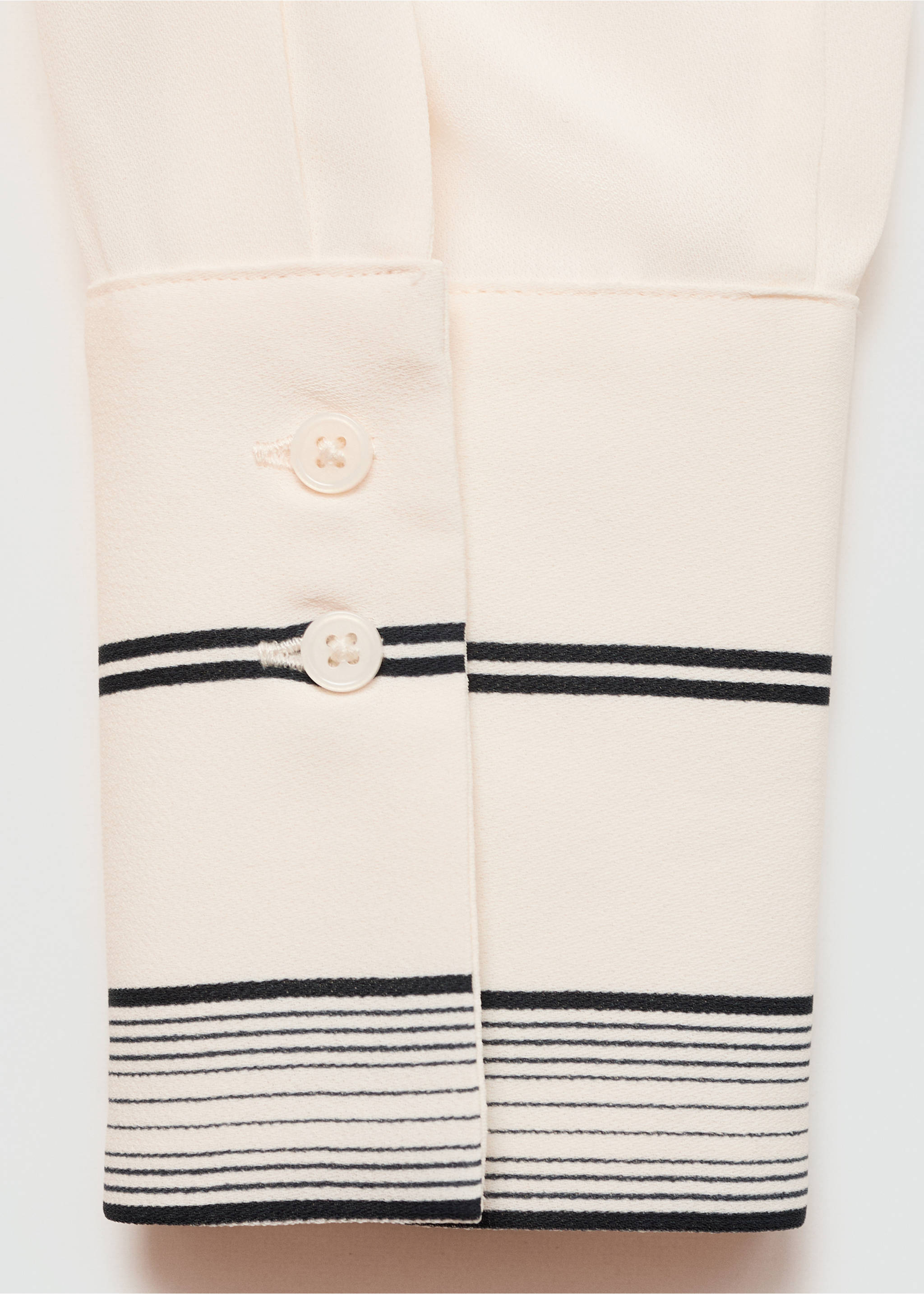 Cream shirt cuff detail with black horizontal stripes and two buttons., Off White. Ref: 77055643-00.