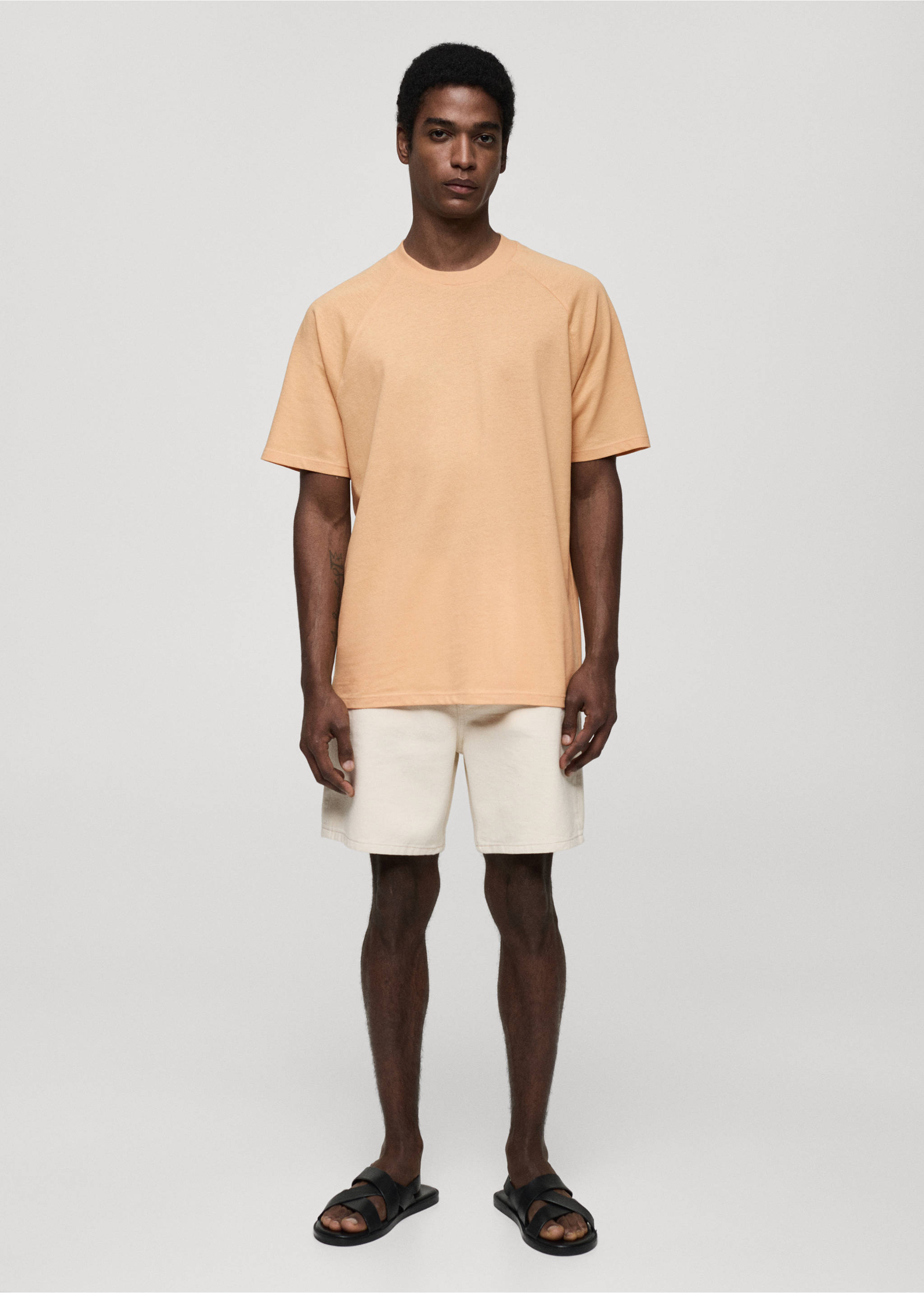 Peach-coloured short-sleeved t-shirt with raglan sleeves and a relaxed fit, worn with off-white shorts., Orange. Ref: 77060356-00.