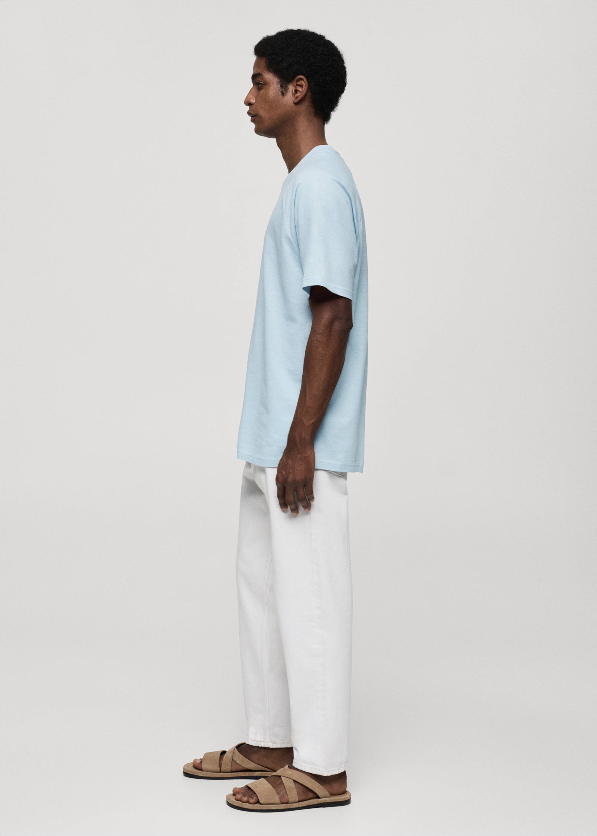 Light blue short-sleeved crew neck t-shirt worn with white trousers., Sky Blue. Ref: 77060356-00.