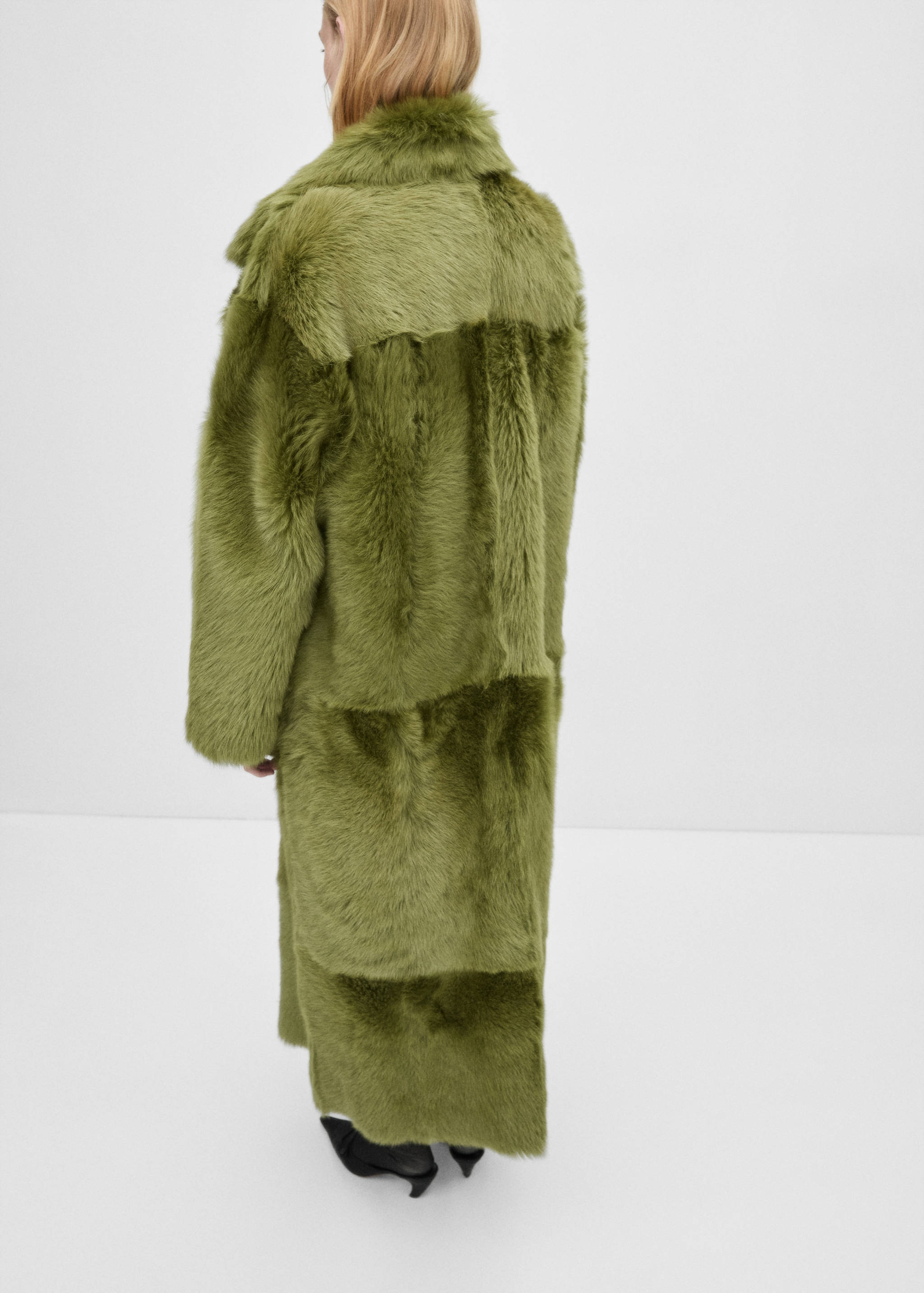 Manteau cuir fourrure - Verso de l’article