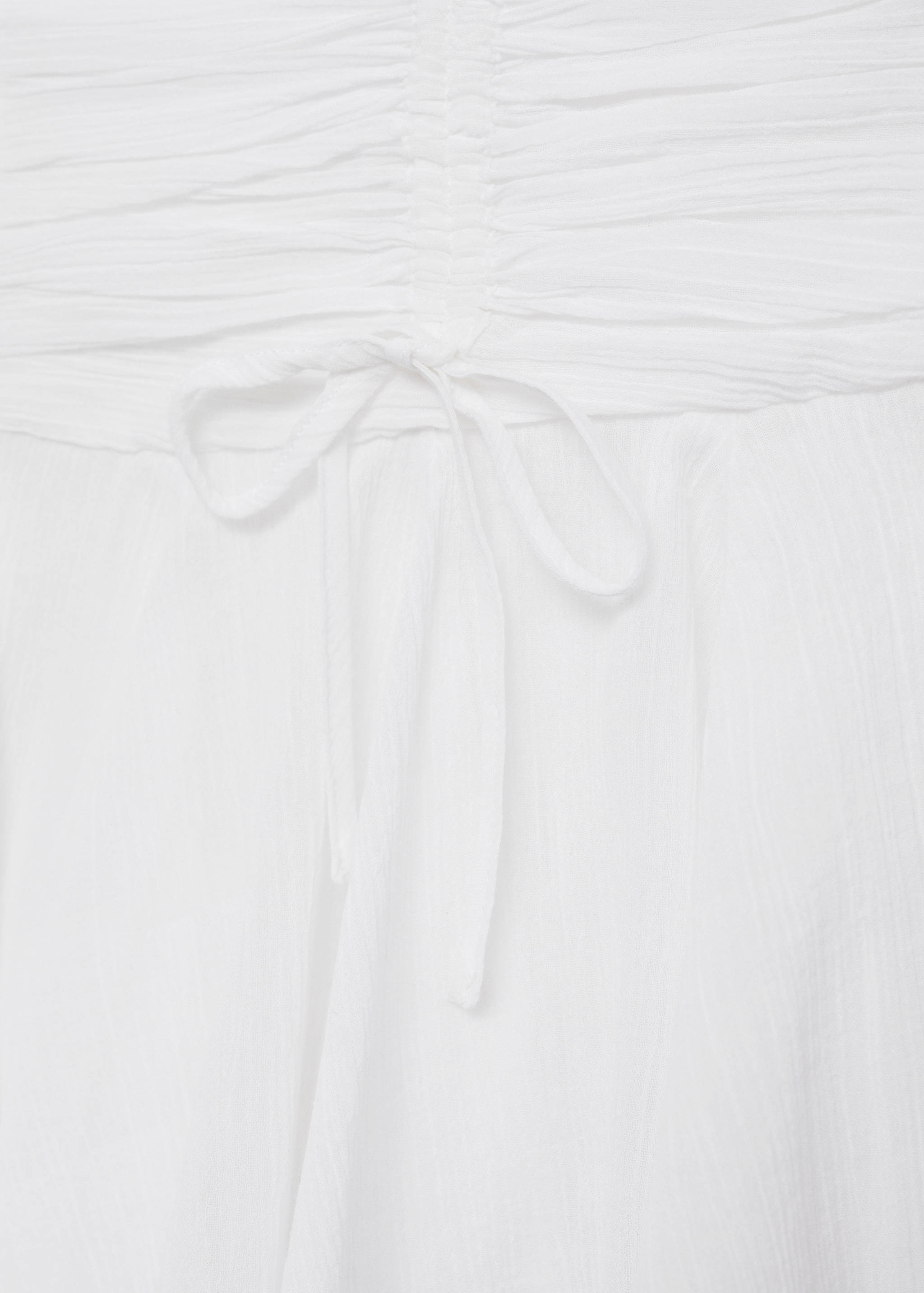 带蝴蝶结的不对称迷你裙 - null