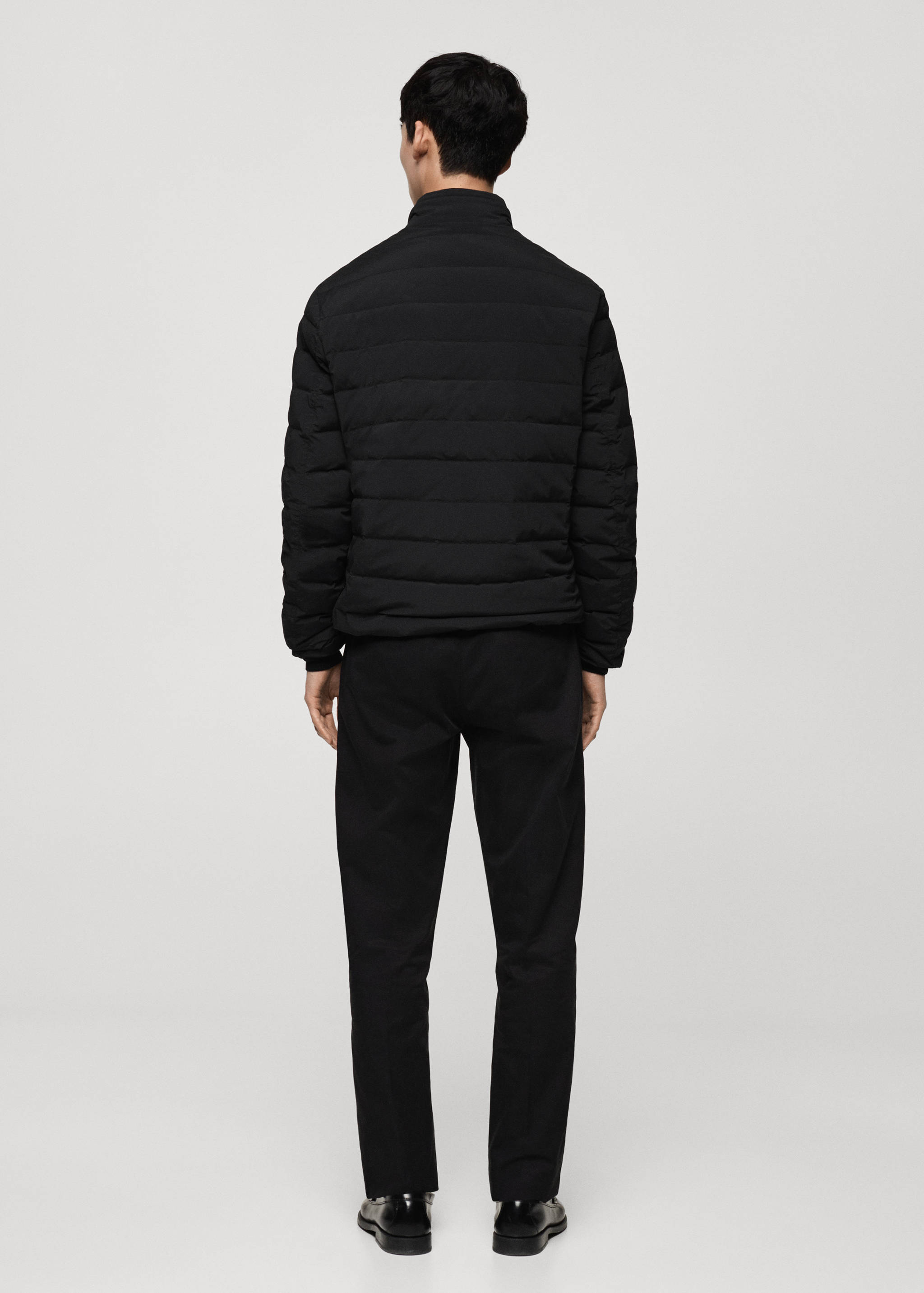 Quilted jacket with feather filling - Reverse of the article