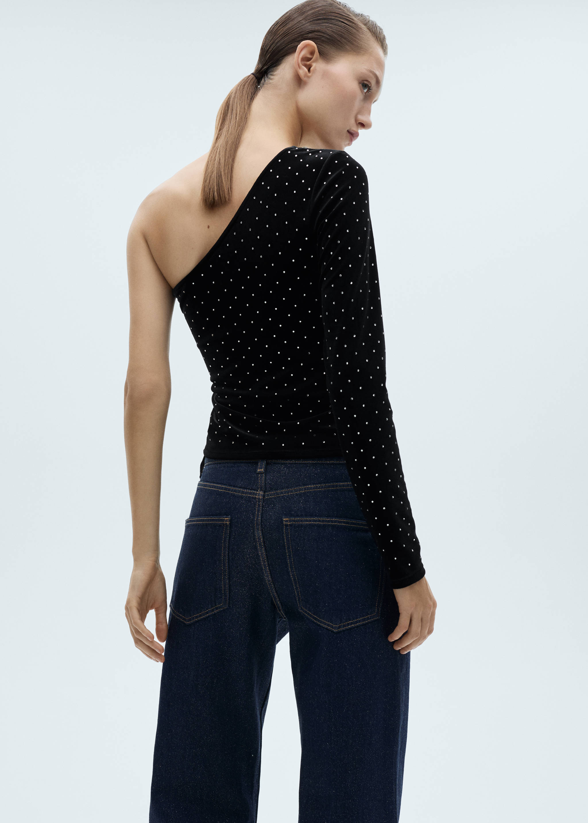 Asymmetrical velvet top with rhinestones - Reverse of the article