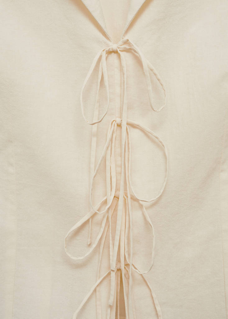Sleeveless blouse with bows — Ecru