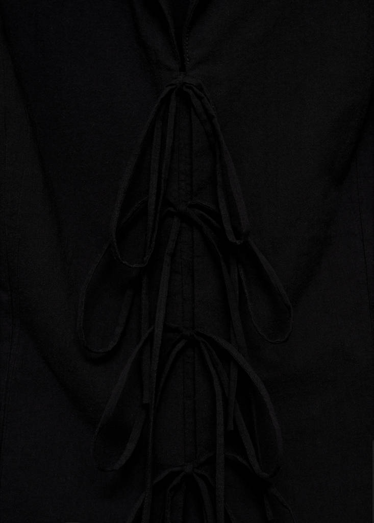 Sleeveless blouse with bows — Black