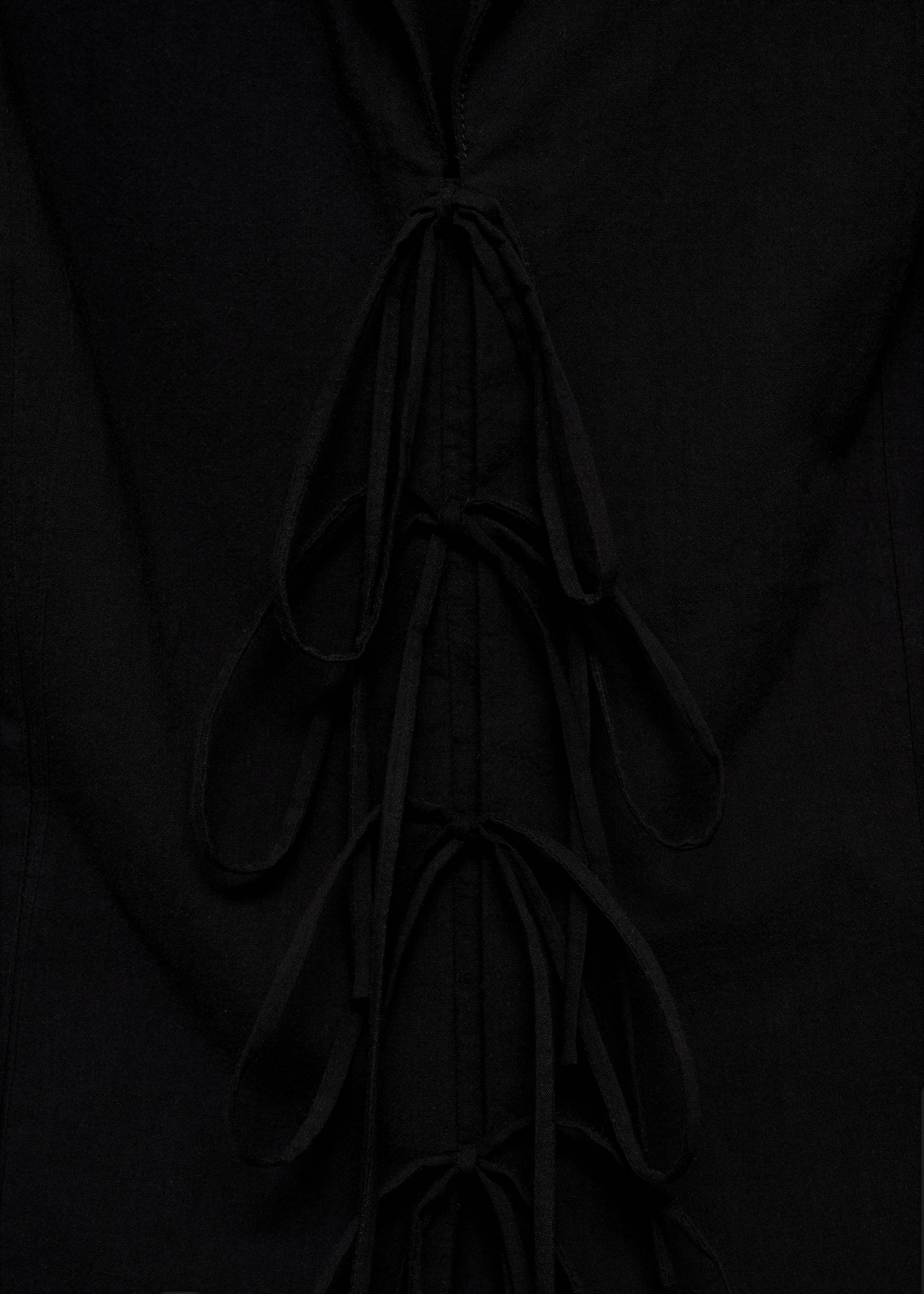 Sleeveless blouse with bows - Details of the article 0