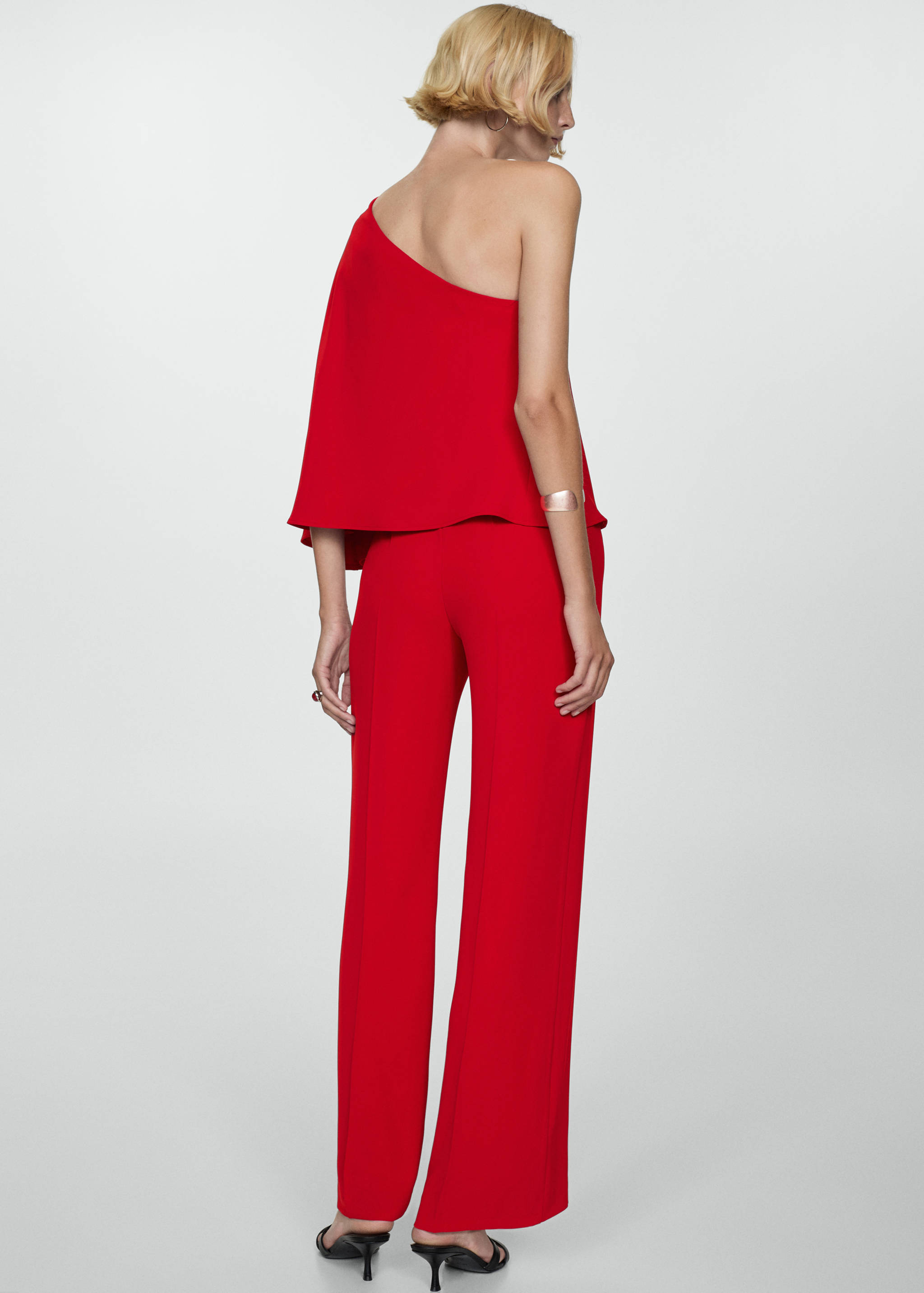 Cape jumpsuit with asymmetrical sleeves - Reverse of the article