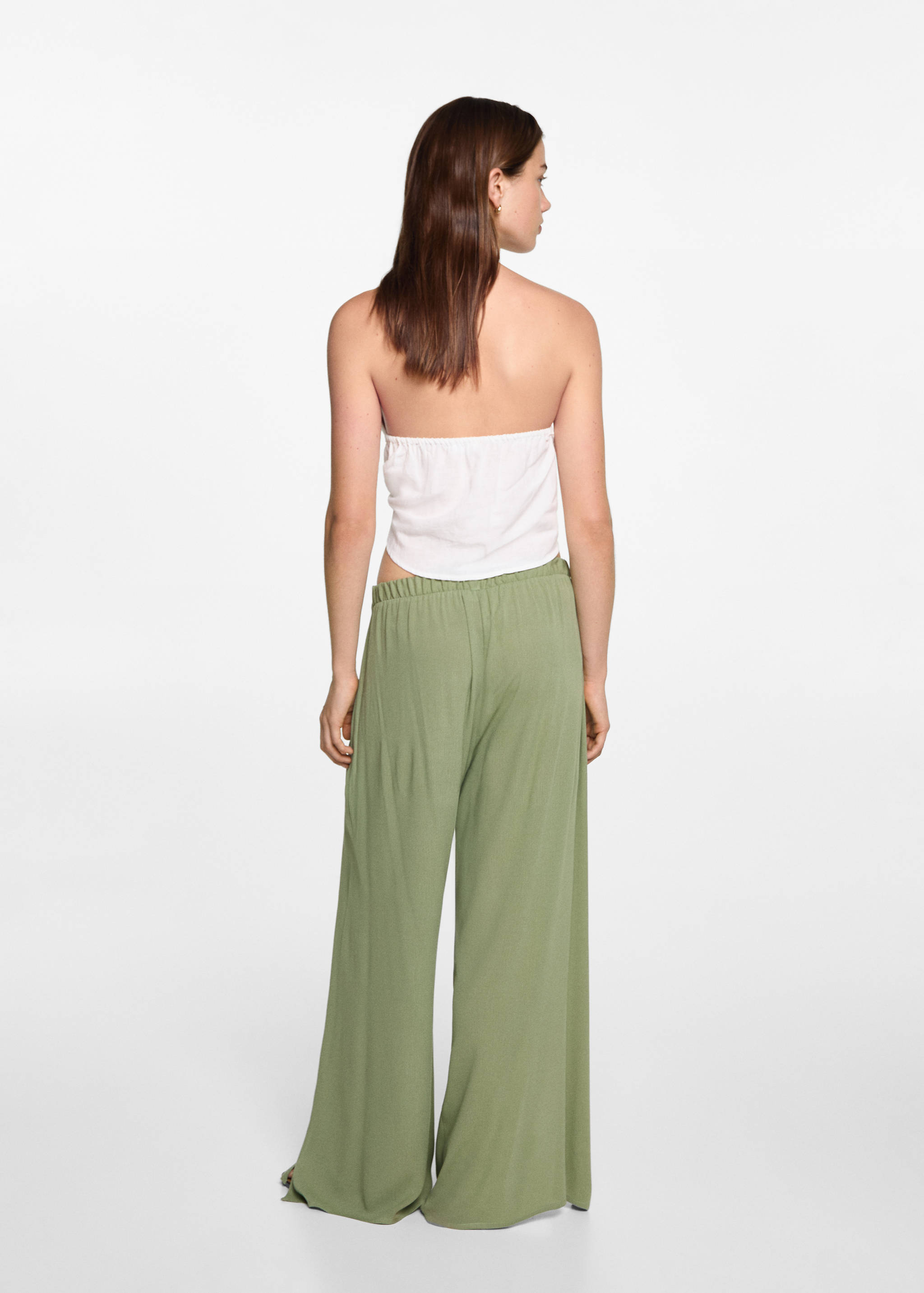 Palazzo trousers with openings - Reverse of the article