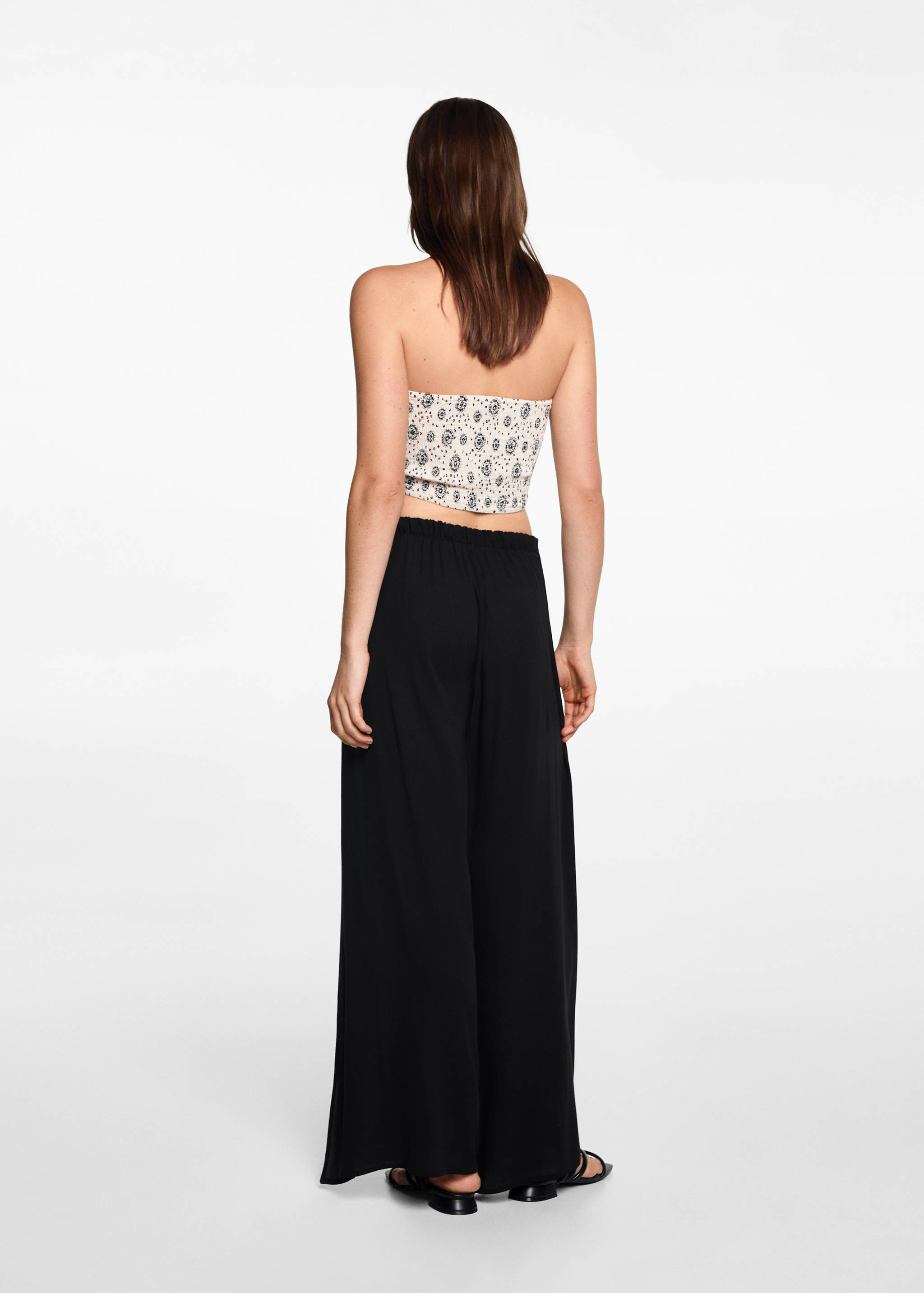 Palazzo trousers with openings - Reverse of the article