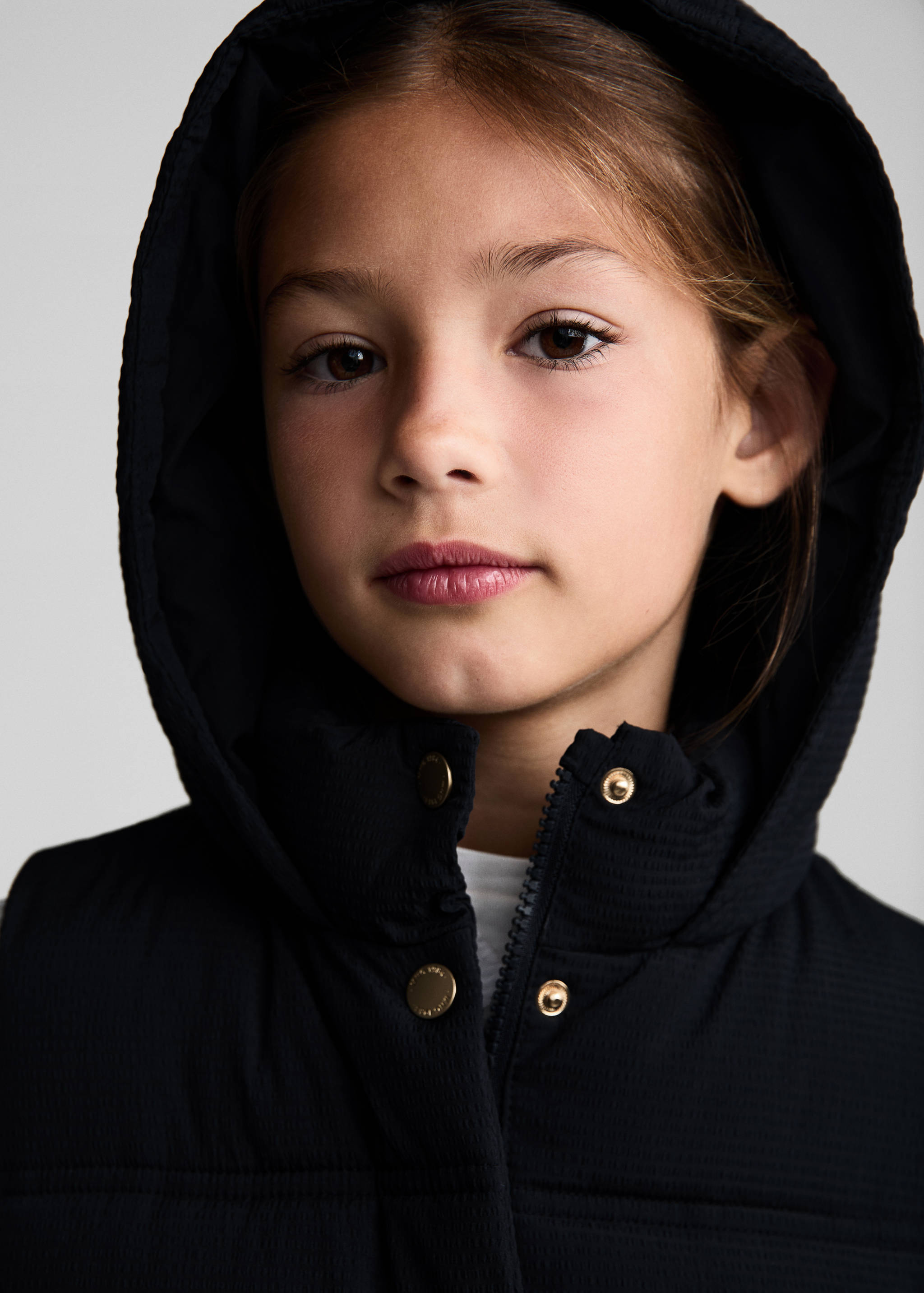 Armilla embuatada caputxa - Detall de l'article 1