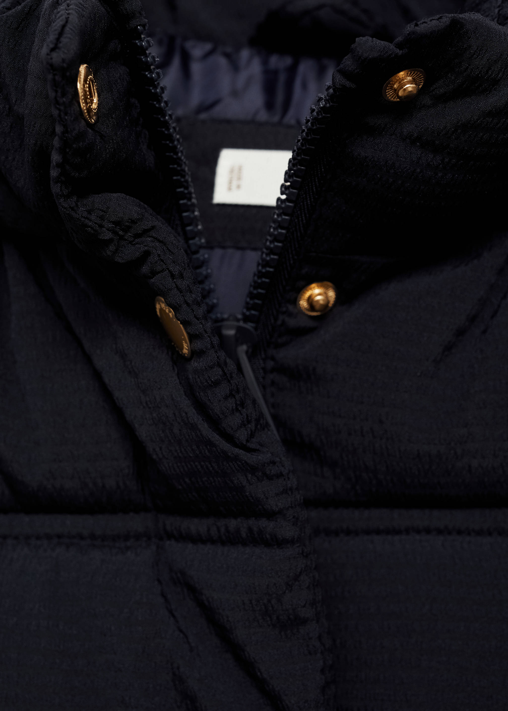 Armilla embuatada caputxa - Detall de l'article 8