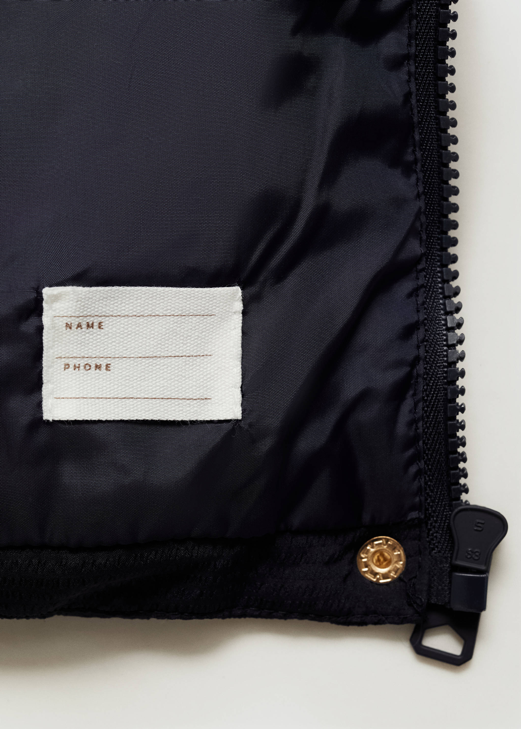 Armilla embuatada caputxa - Detall de l'article 0