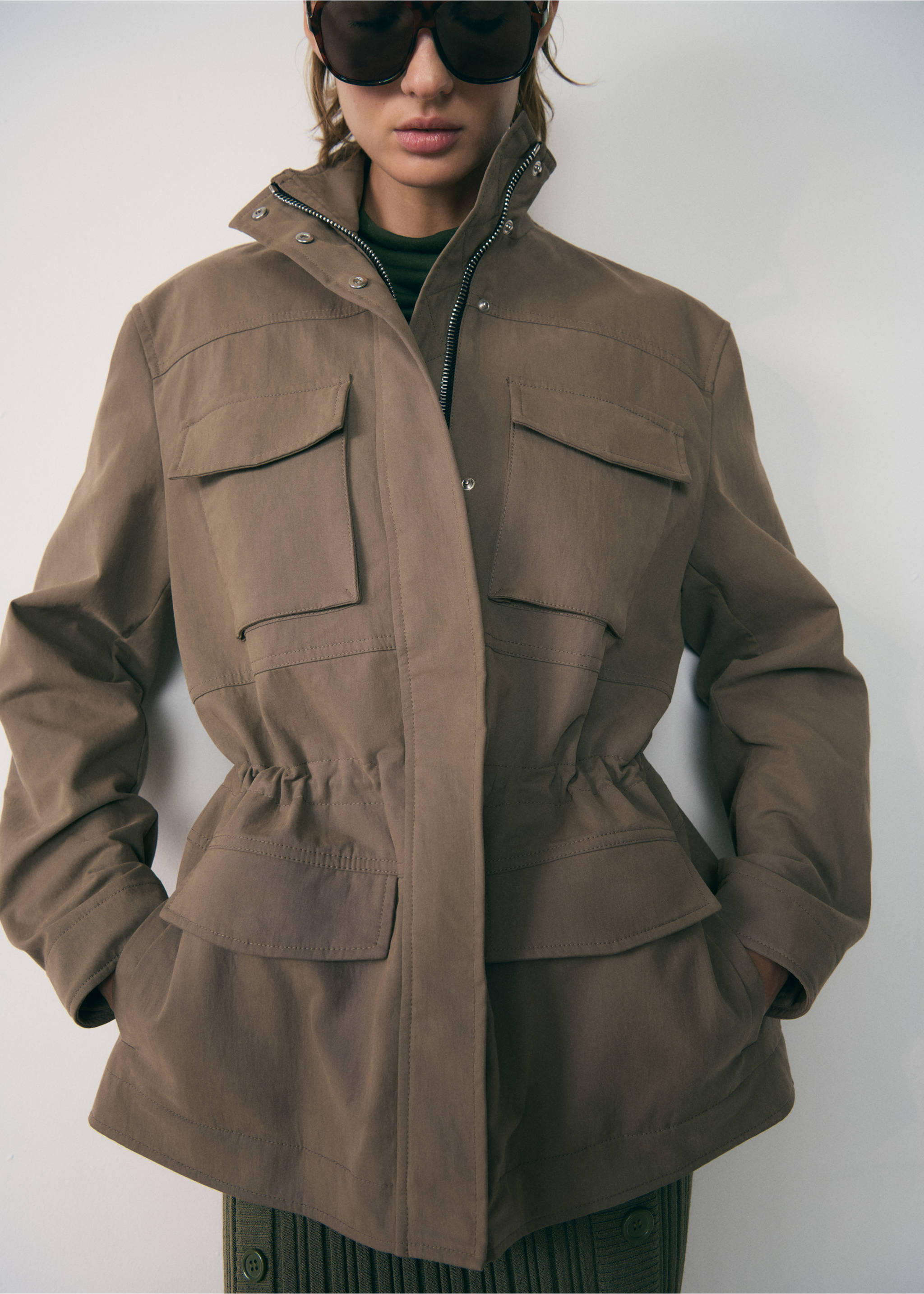 Turtleneck parka with pockets - Details of the article 1, Medium Brown. Ref: 77947938-00.