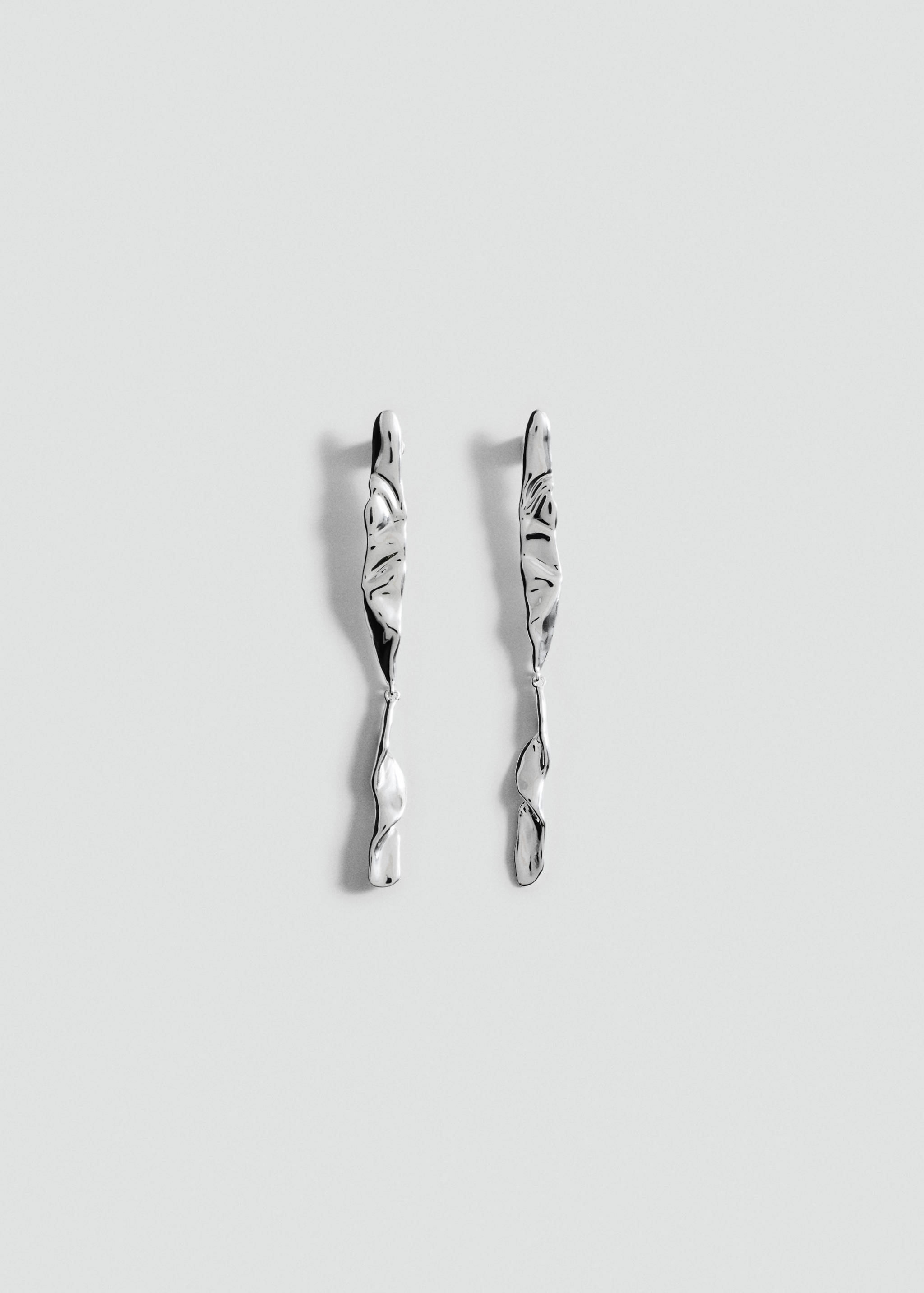Rigid textured earrings - Article without model