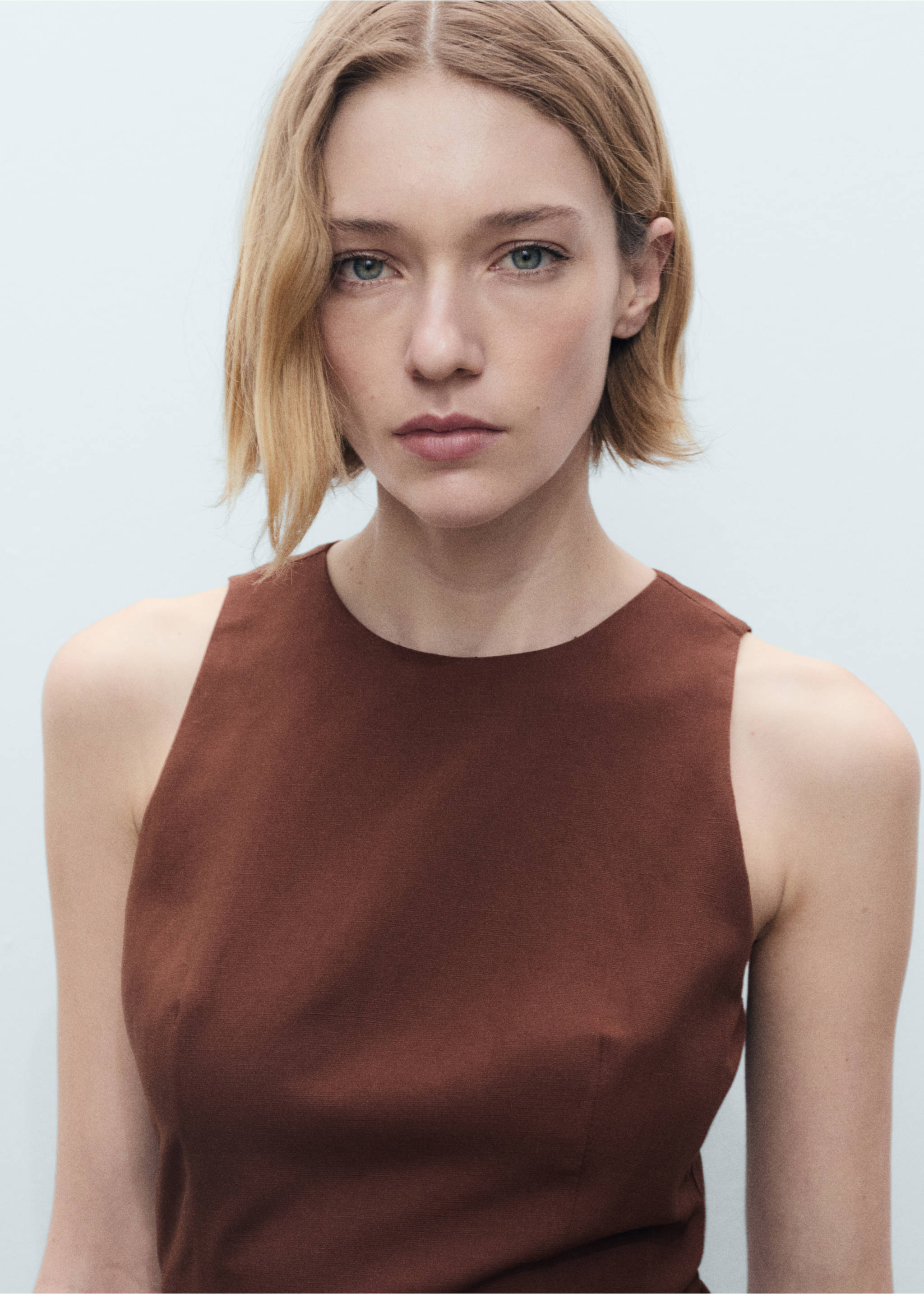 Close-up of a brown sleeveless dress with a round neckline., Brown. Ref: 87007192-00.