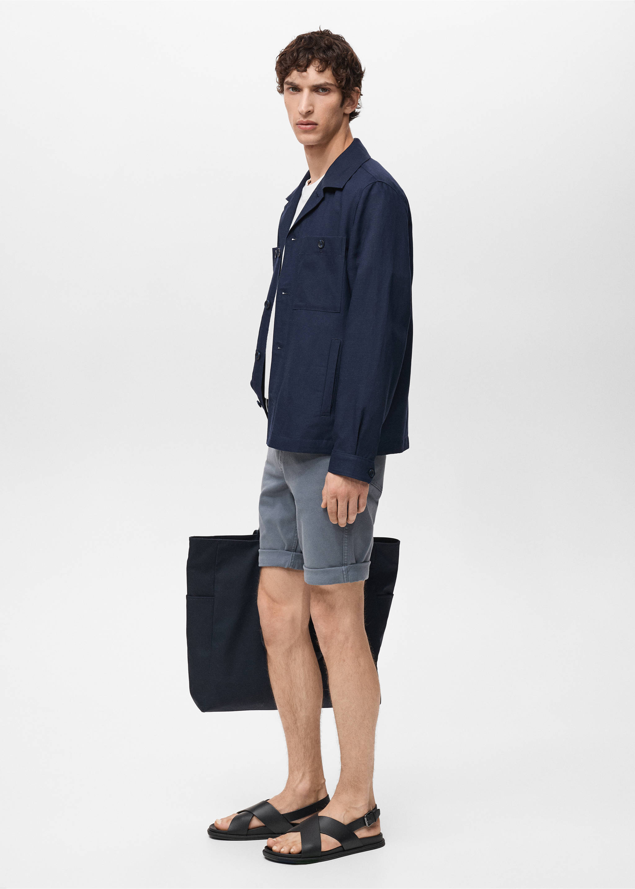 Grey bermuda shorts with rolled cuffs, styled with a navy overshirt., Indigo Blue. Ref: 87007893-00.