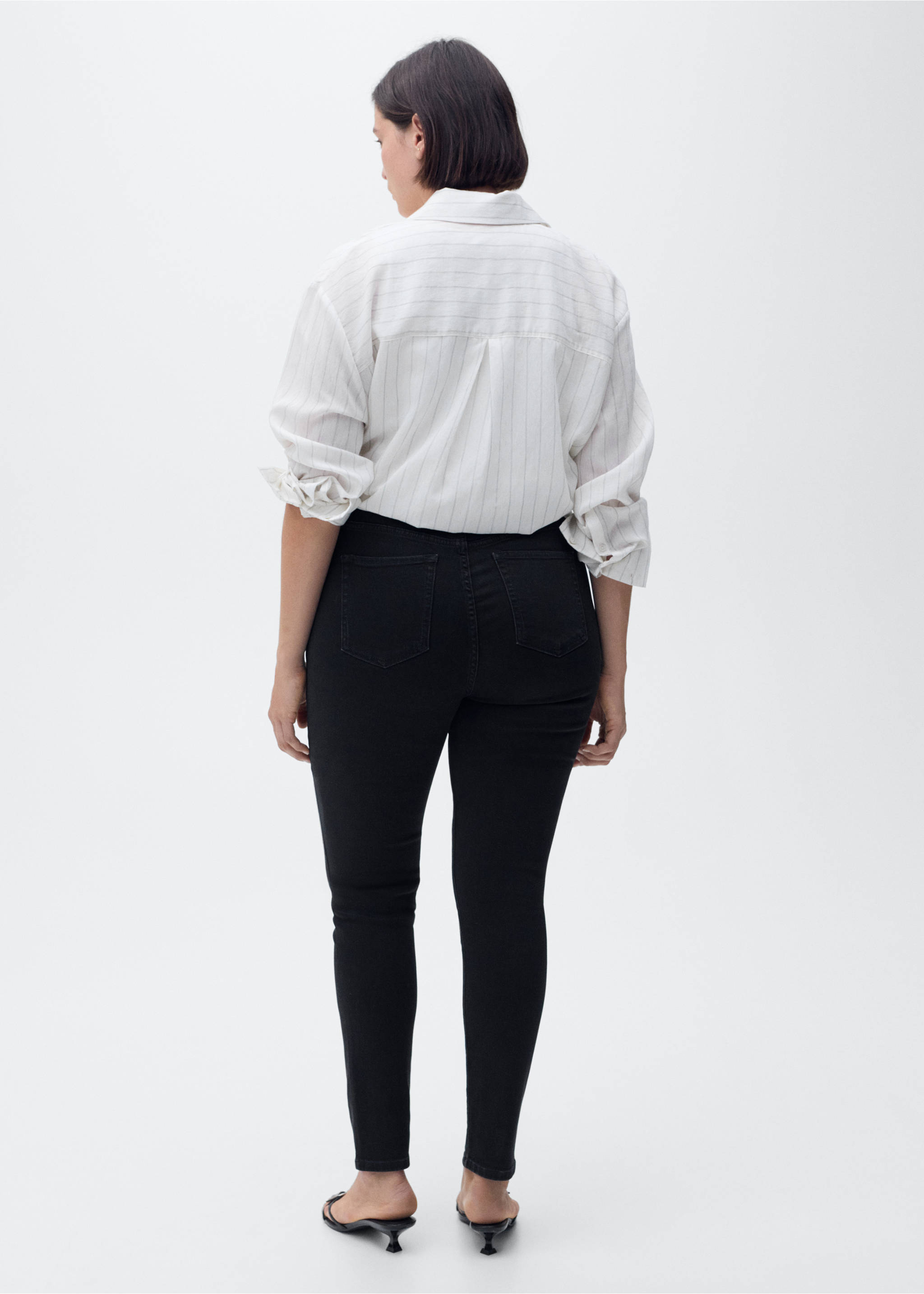 High-rise skinny jeans - Details of the article 4, Black denim. Ref: 87010285-00.