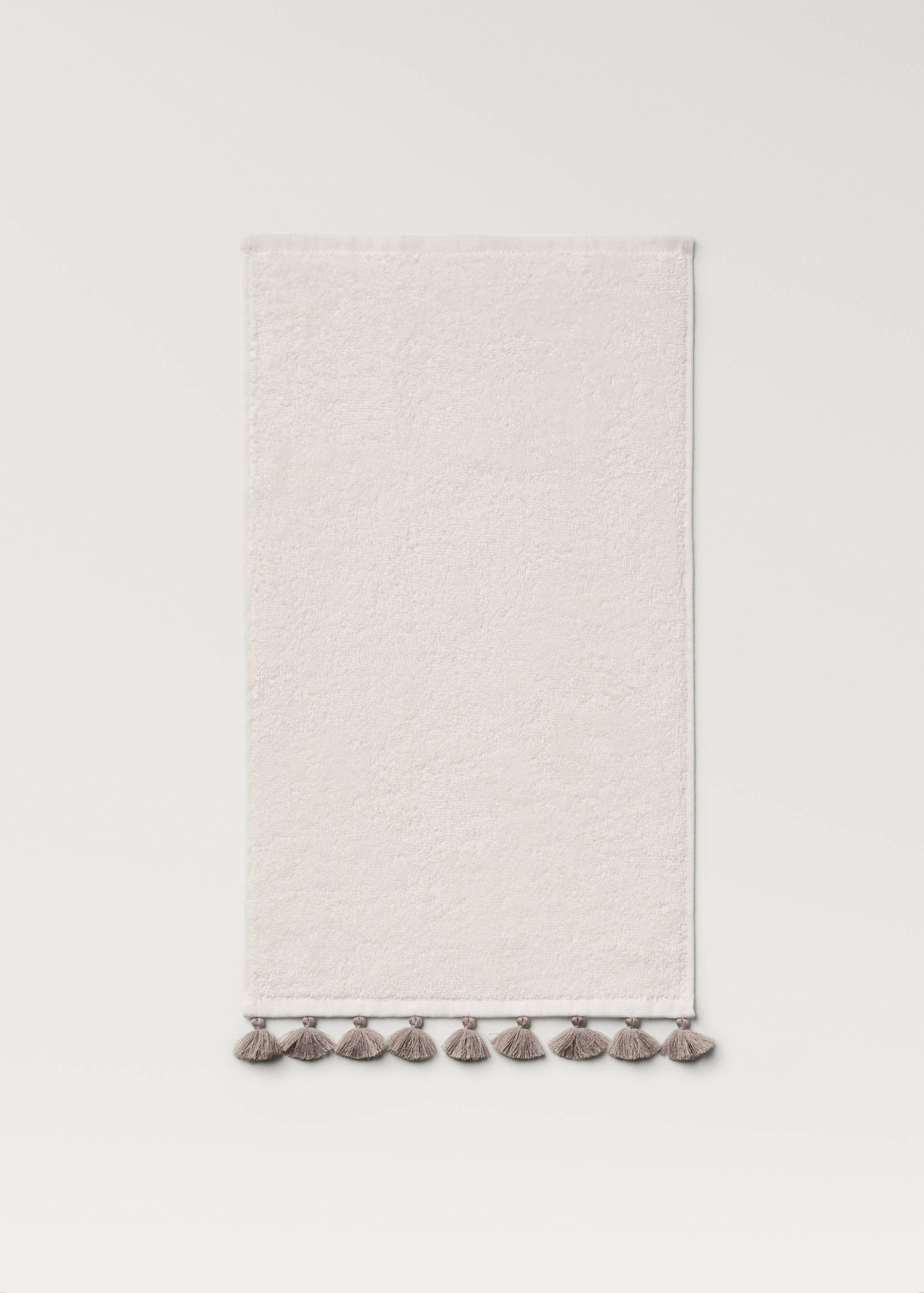 Towel with contrasting pom-poms - Details of the article 4