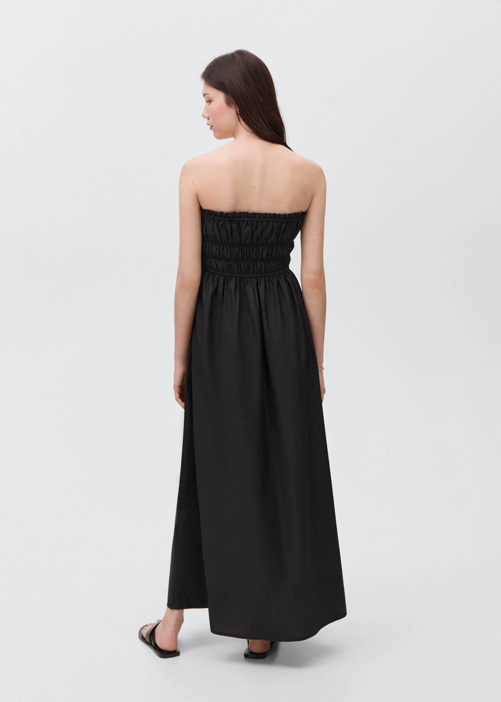Flared dress with ruffled hem - Reverse of the article