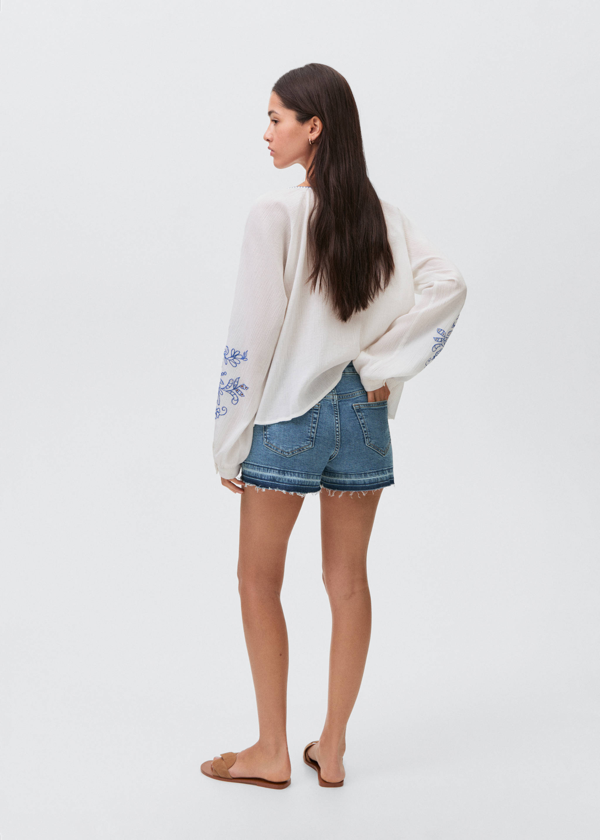 Denim shorts with frayed hem - Reverse of the article