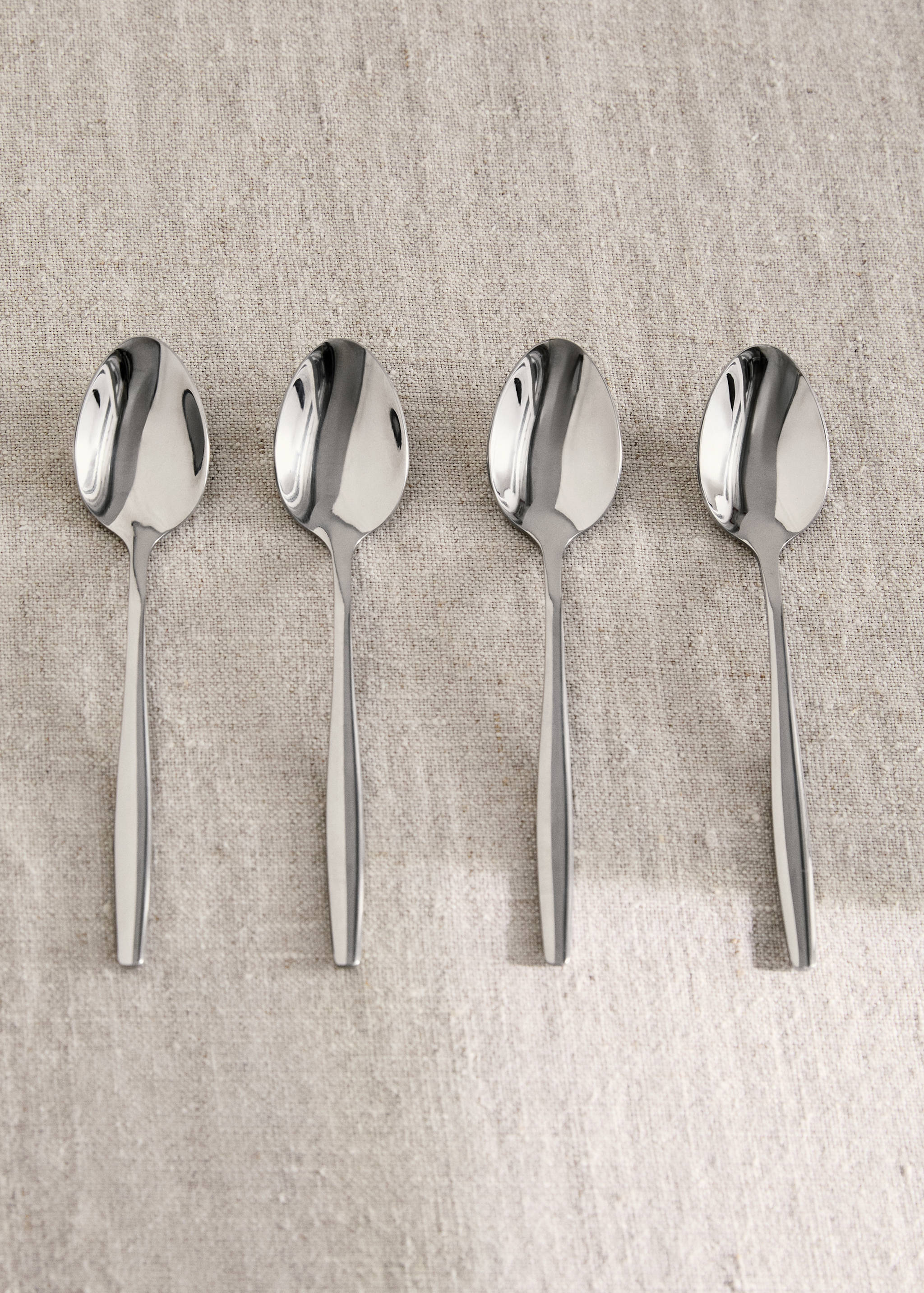 Set of 4 stainless steel dessert spoons with slim handles - General plane