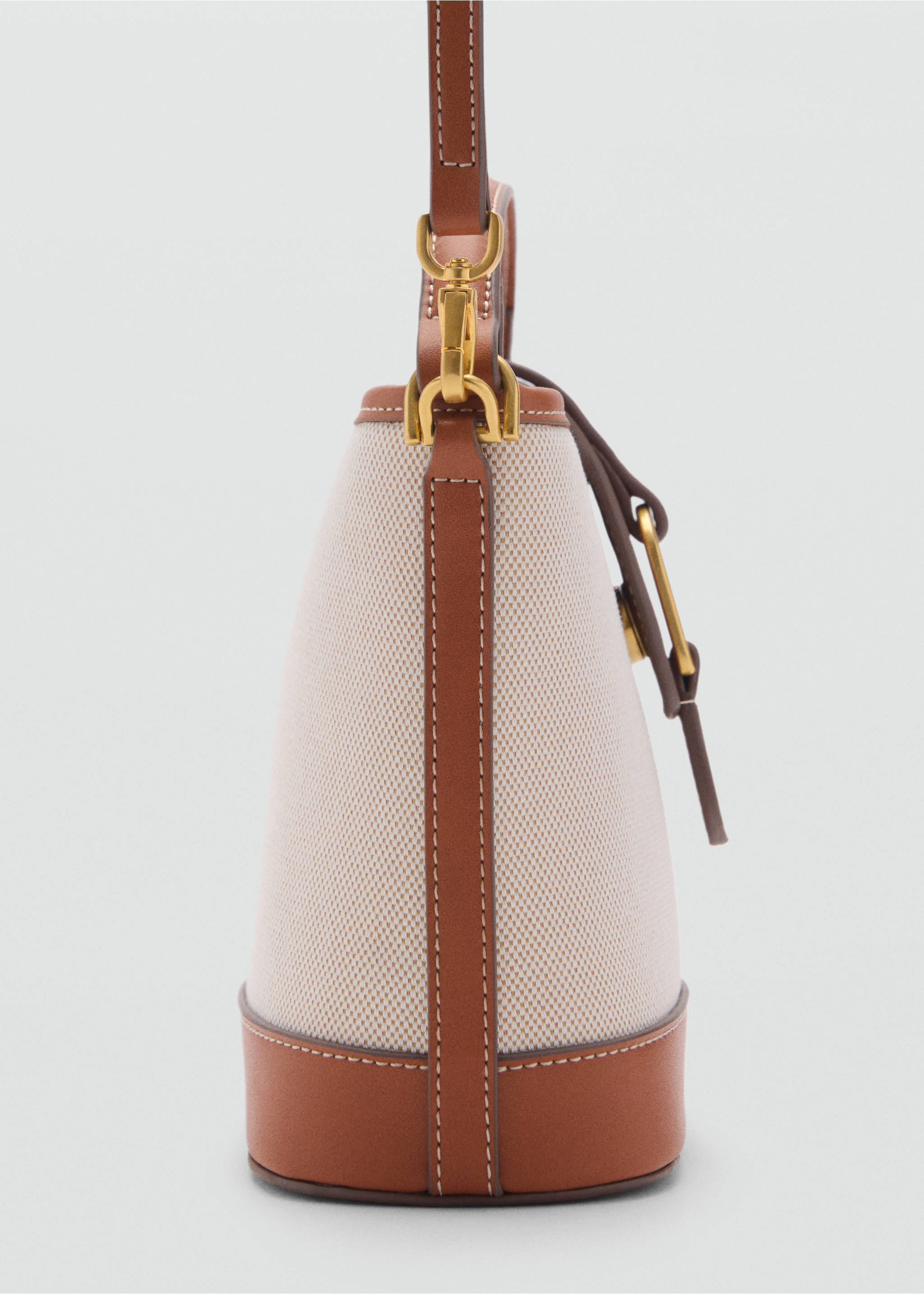 Contrasting canvas bucket bag - Details of the article 1, Leather. Ref: 87025743-00.