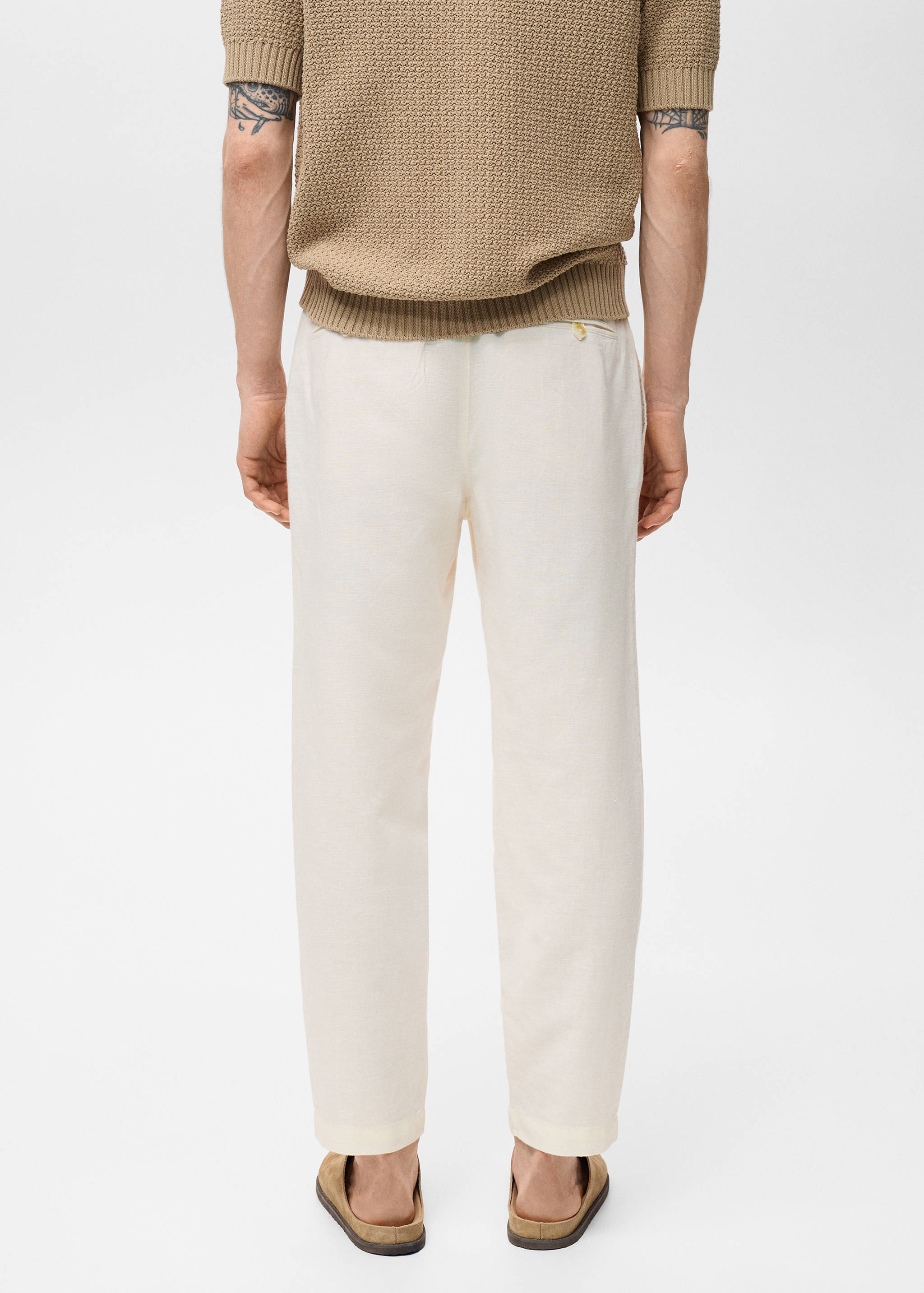 Slim-fit pants with drawstring - Reverse of the article