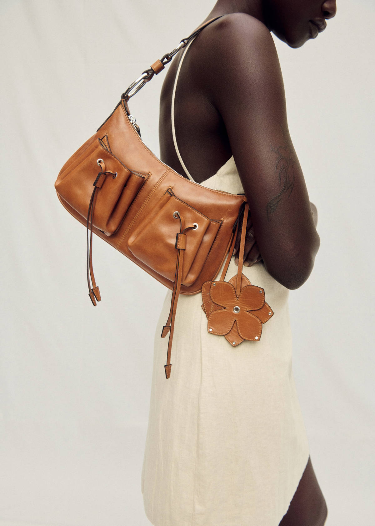 Leather shoulder bag with gathered pockets — Leather