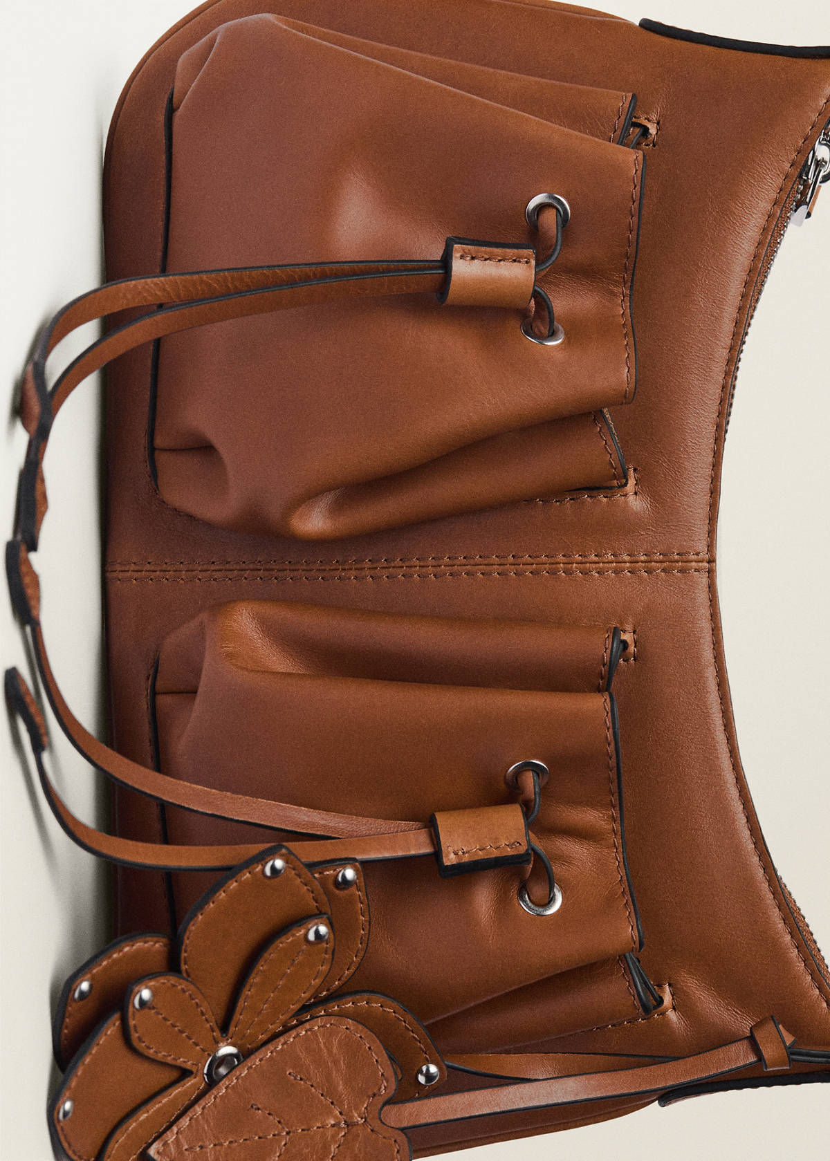 Leather shoulder bag with gathered pockets — Leather