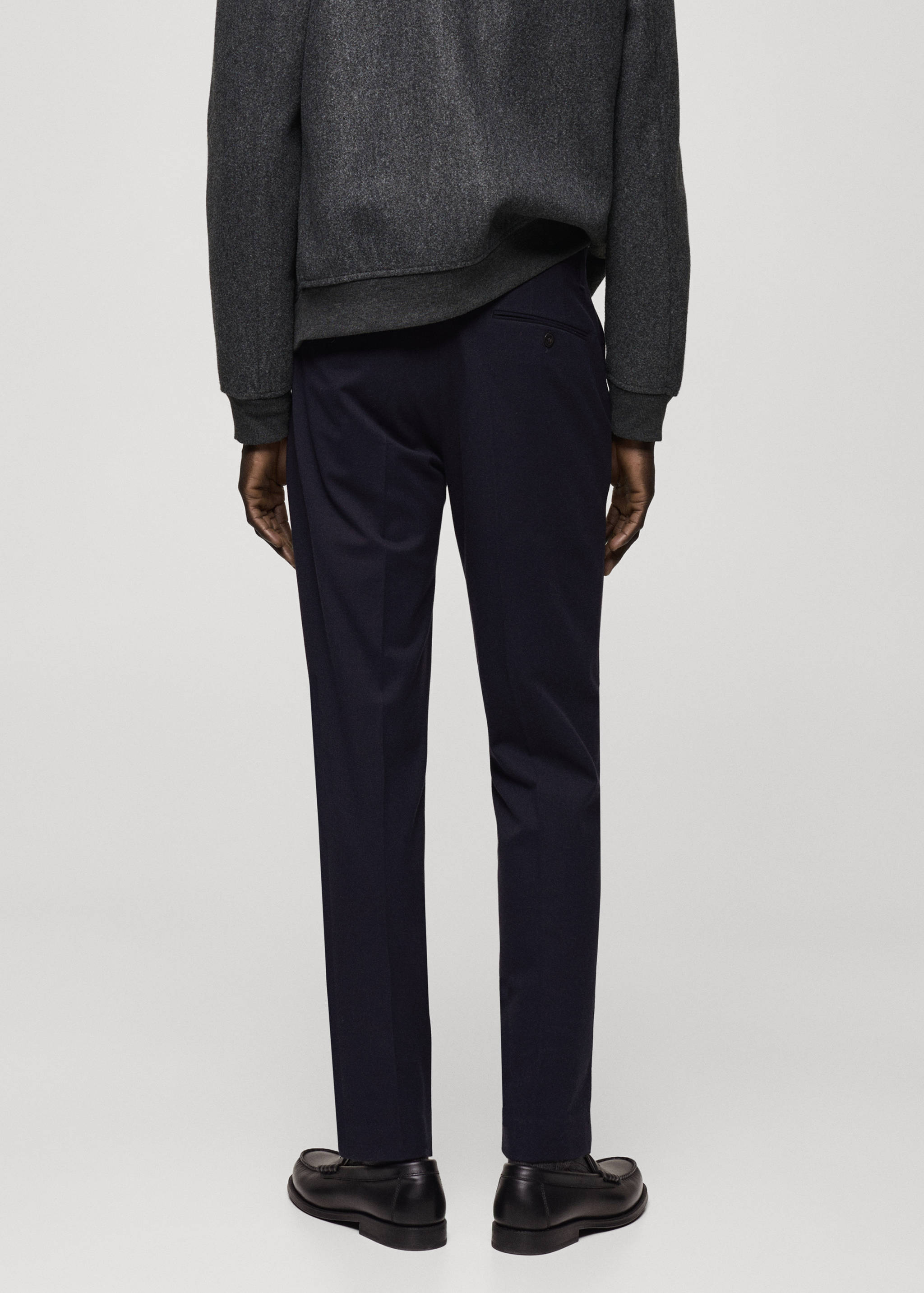 Wool flannel pants with pleats - Reverse of the article