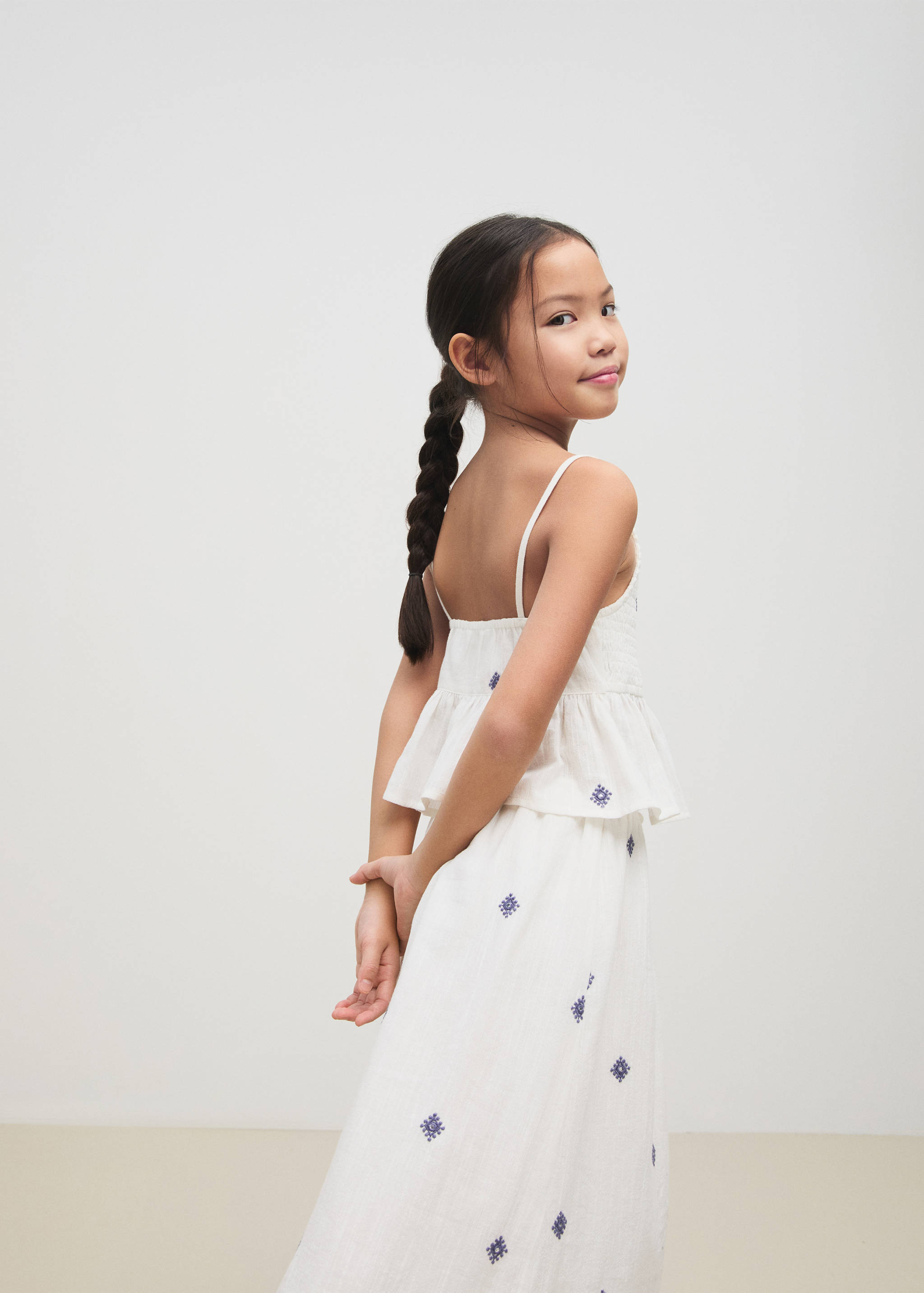 Ruffled blouse with embroidered details - General plane