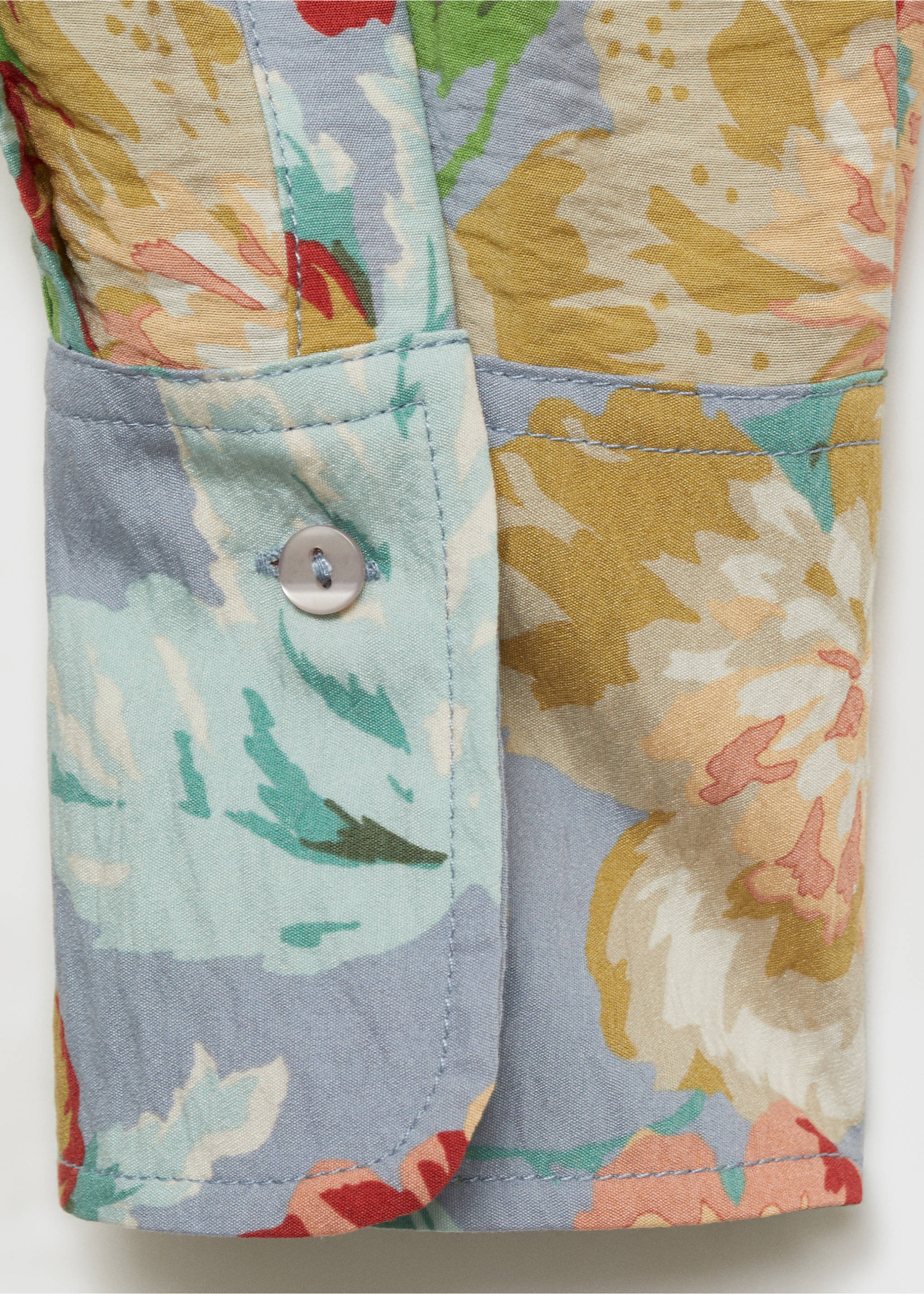 Close-up of a floral print shirt cuff with fabric detail., Sky Blue. Ref: 87034813-00.
