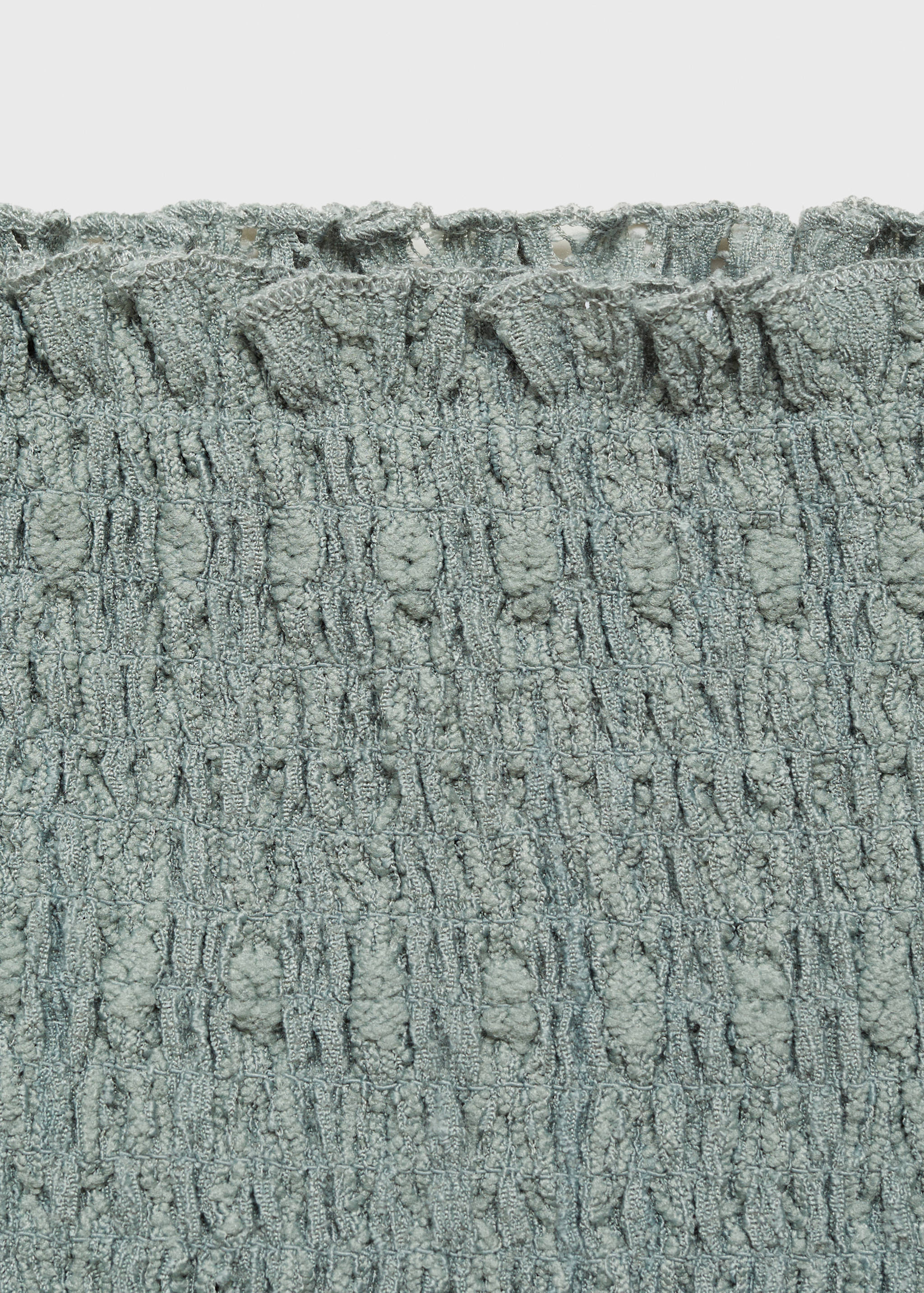 Top caicai rufado - Pormenor do artigo 8