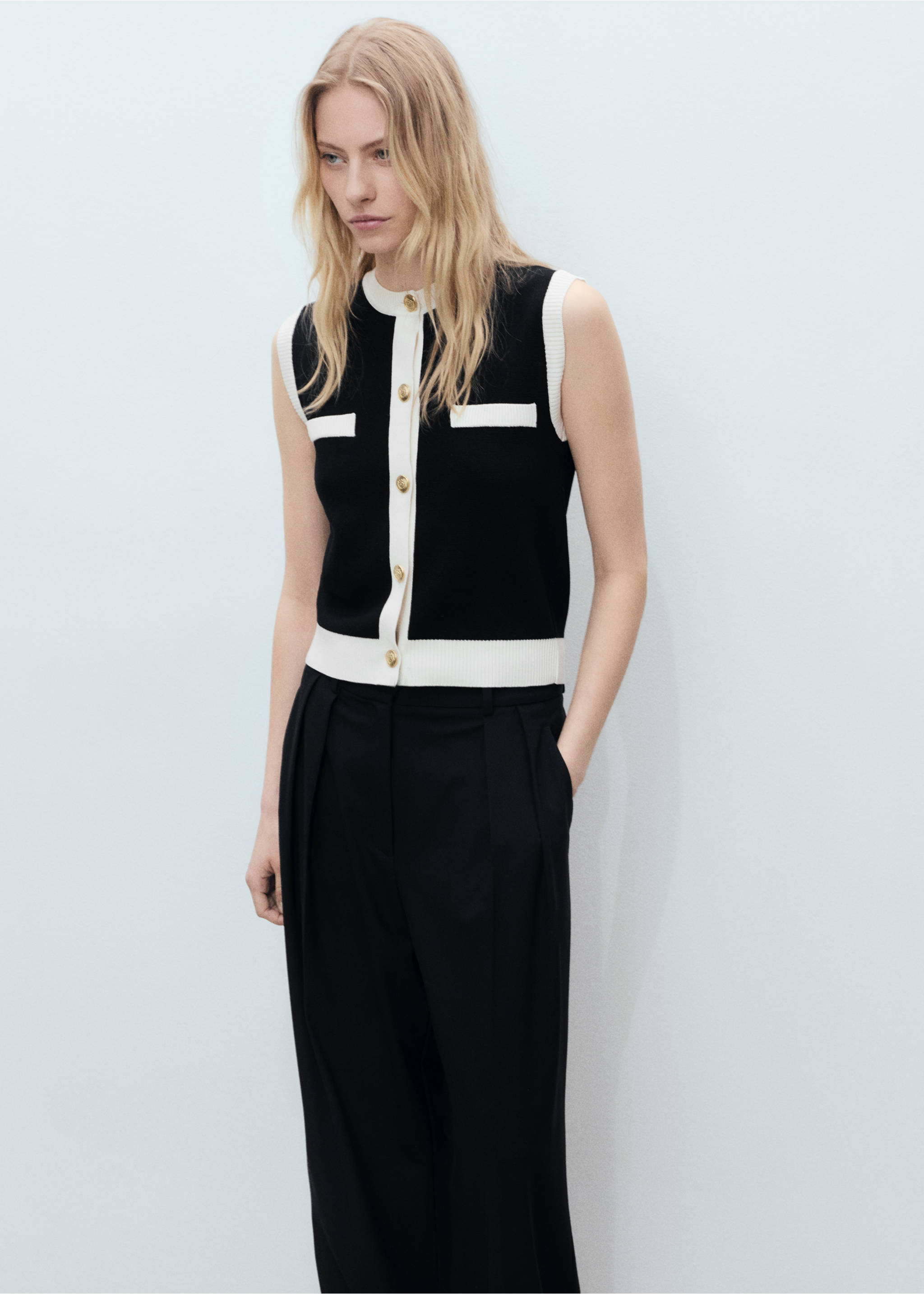 Knitted waistcoat with contrast piping - Details of the article 1, Black. Ref: 87045763-00.