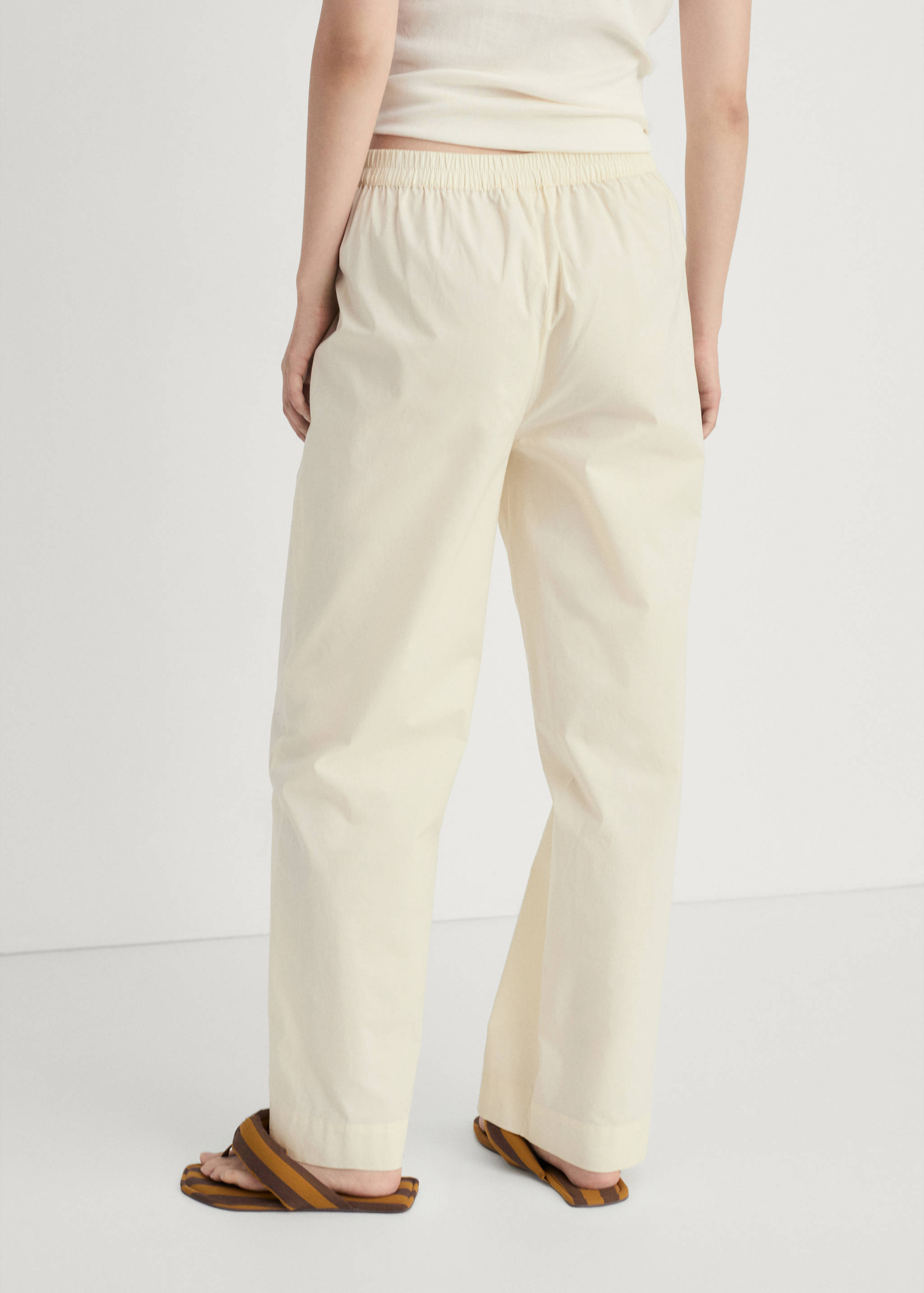 Garment-washed cotton pants - Reverse of the article