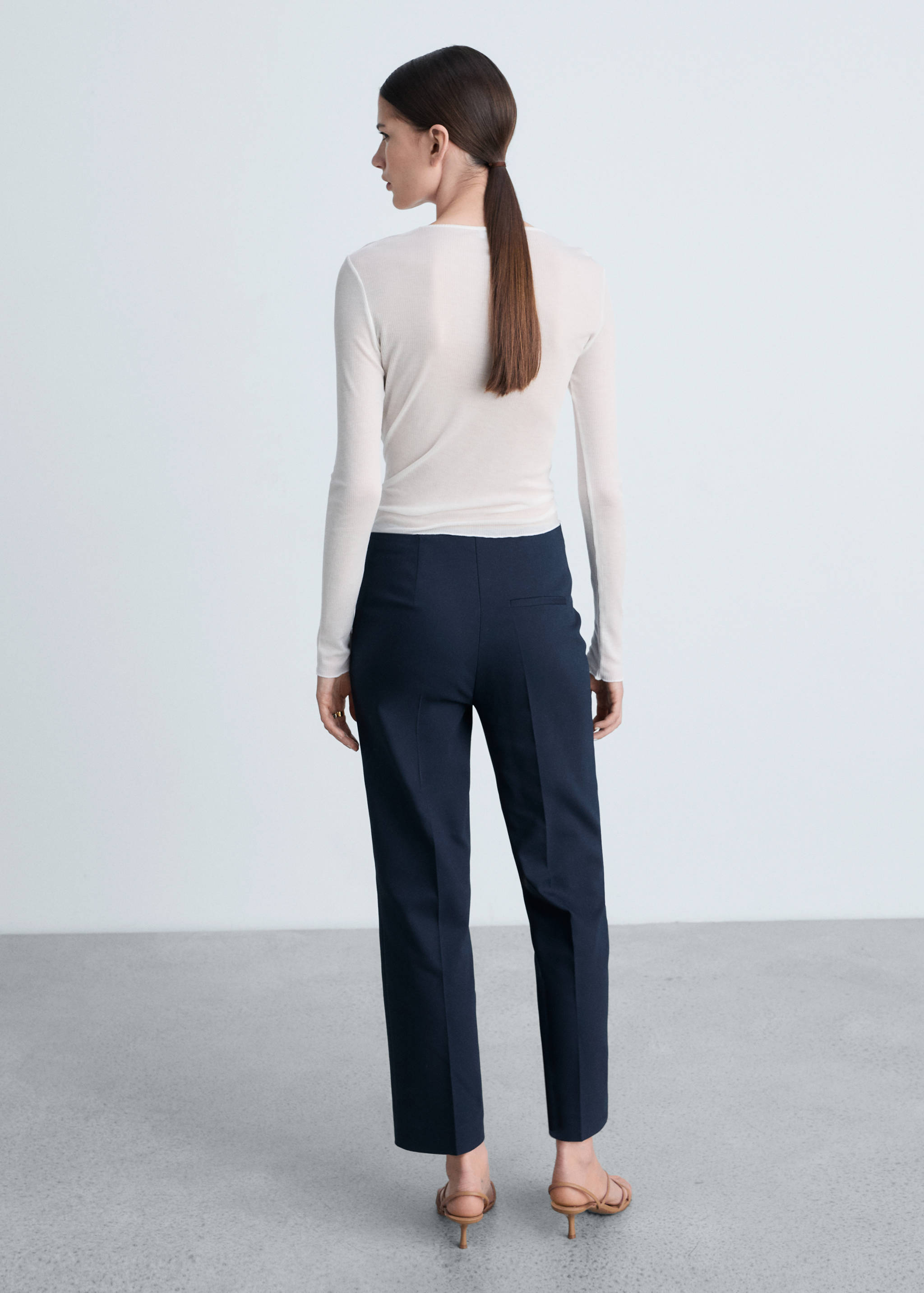 Straight pants with jewel buttons - Reverse of the article