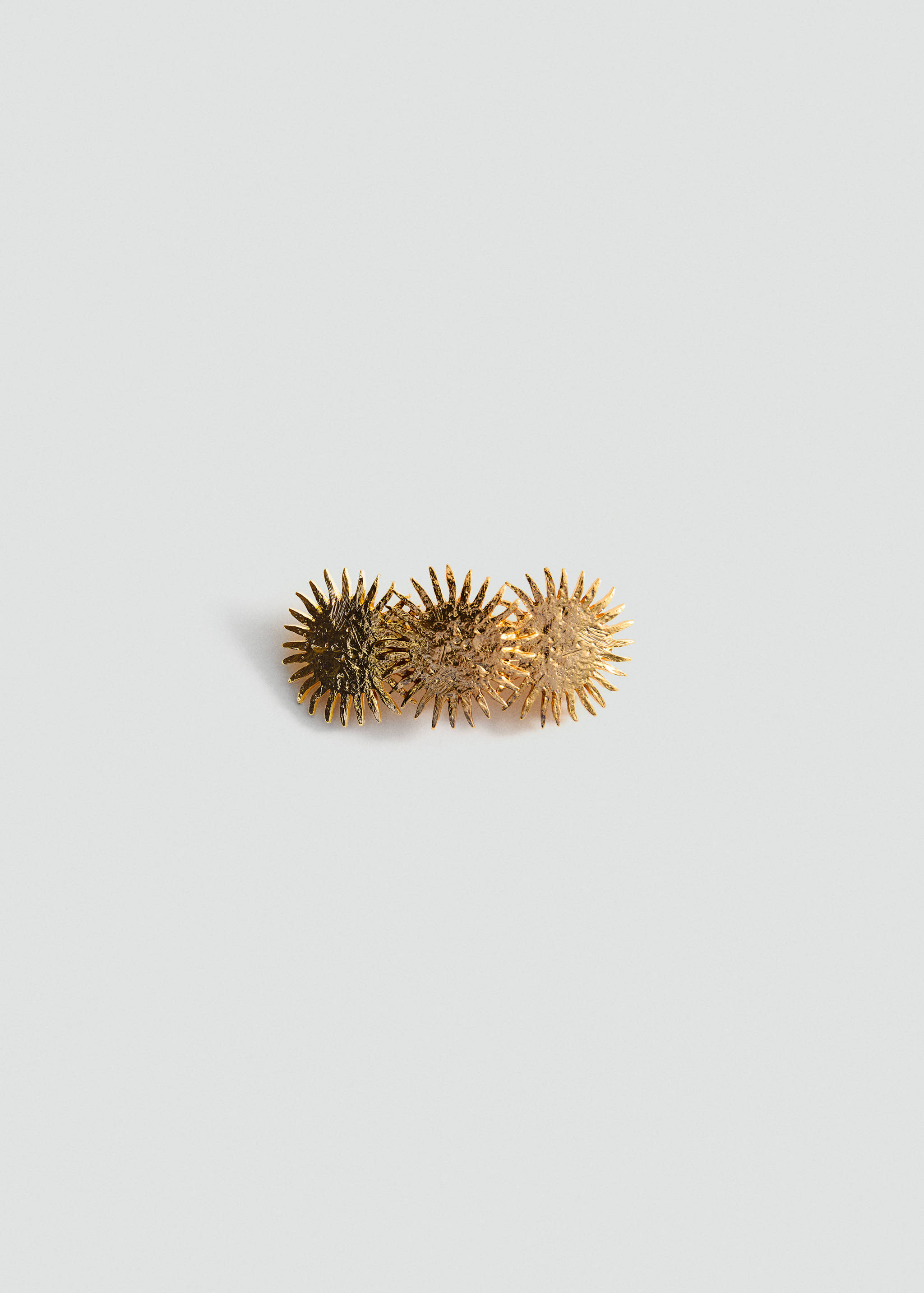 Metal pin with sun design - Article without model