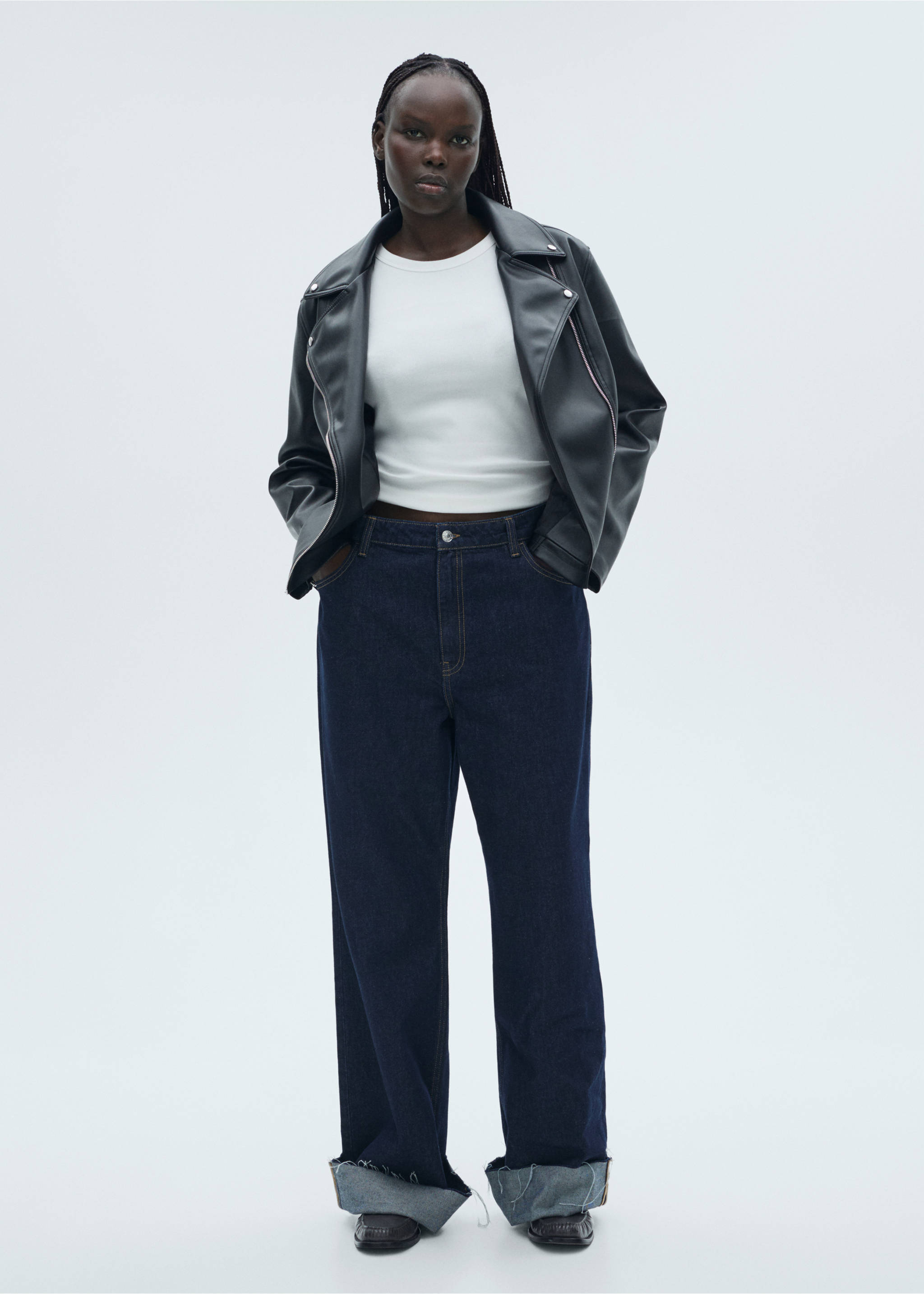 White short-sleeved top with a round neckline, worn with a dark jacket and jeans., White. Ref: 87060433-00.