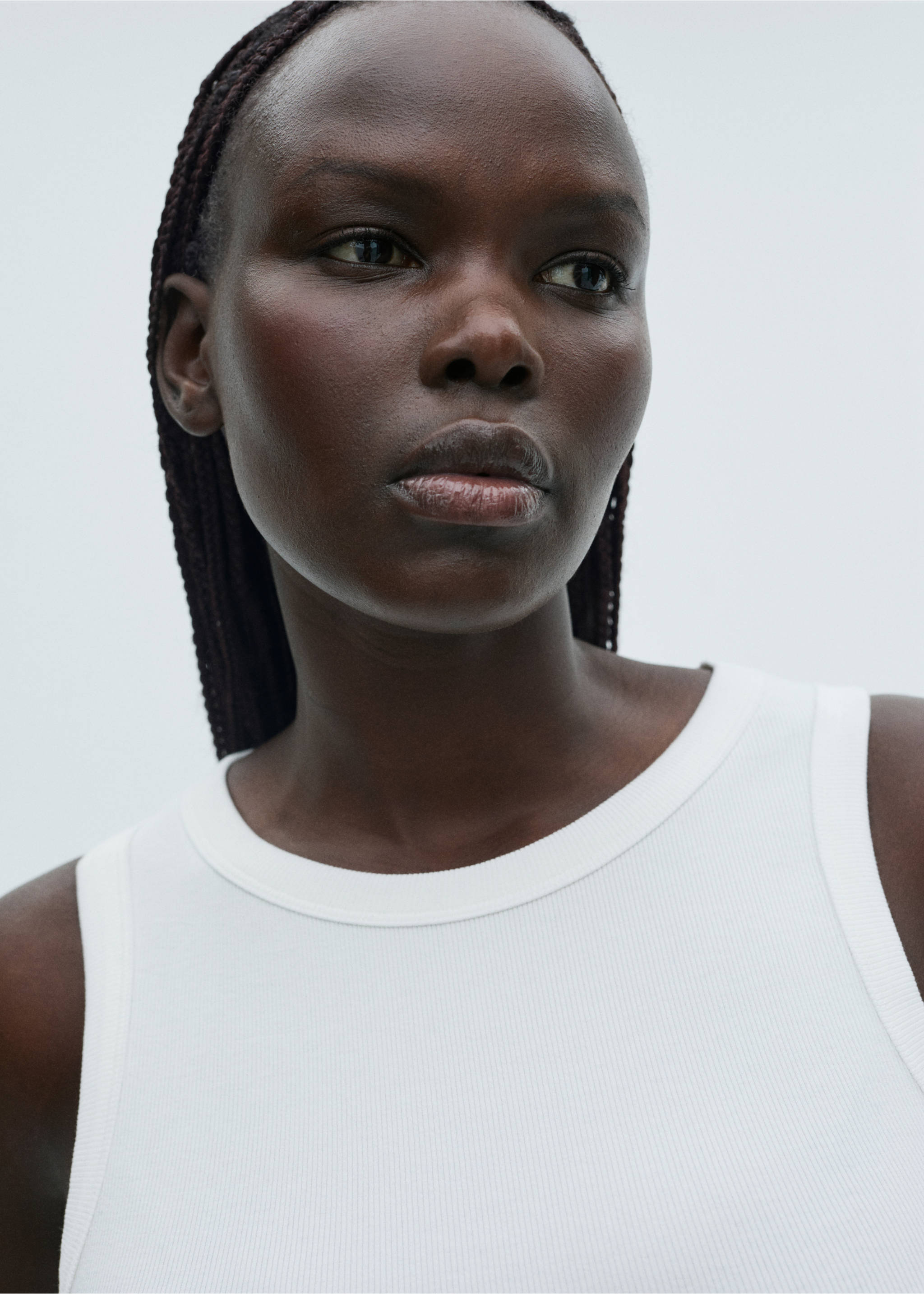 White ribbed tank top with a rounded neckline in a close-up portrait., White. Ref: 87060433-00.