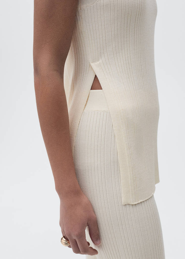 Flared rib-knit trousers — Ecru
