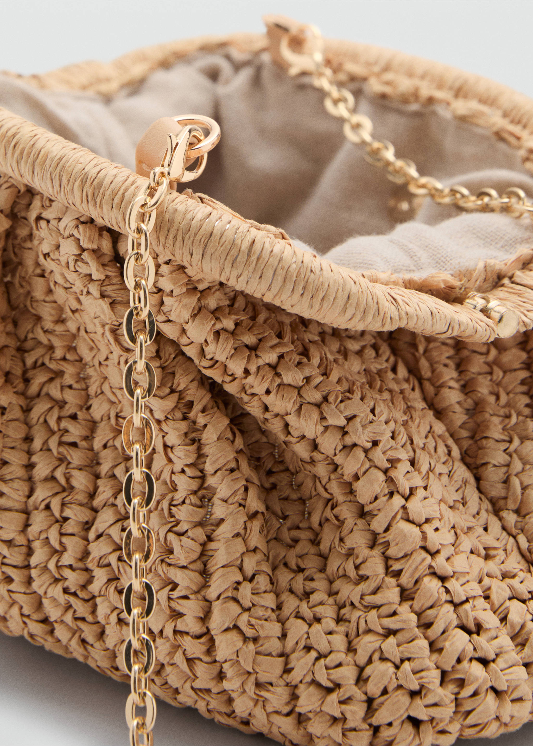 Close-up of a beige woven crossbody bag with a gold-tone chain strap., Beige. Ref: 87065921-00.