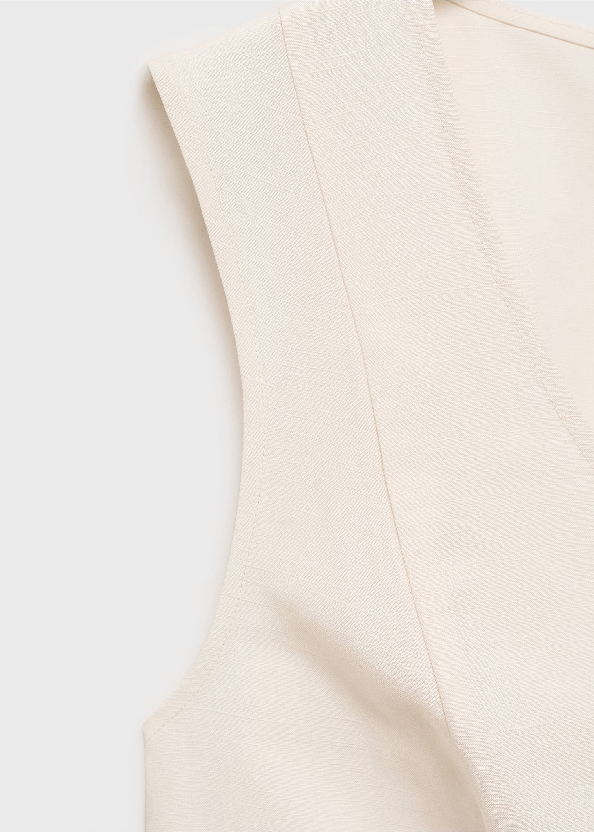 Cream V-neck sleeveless top detail, showing textured fabric., Ecru. Ref: 87067179-00.