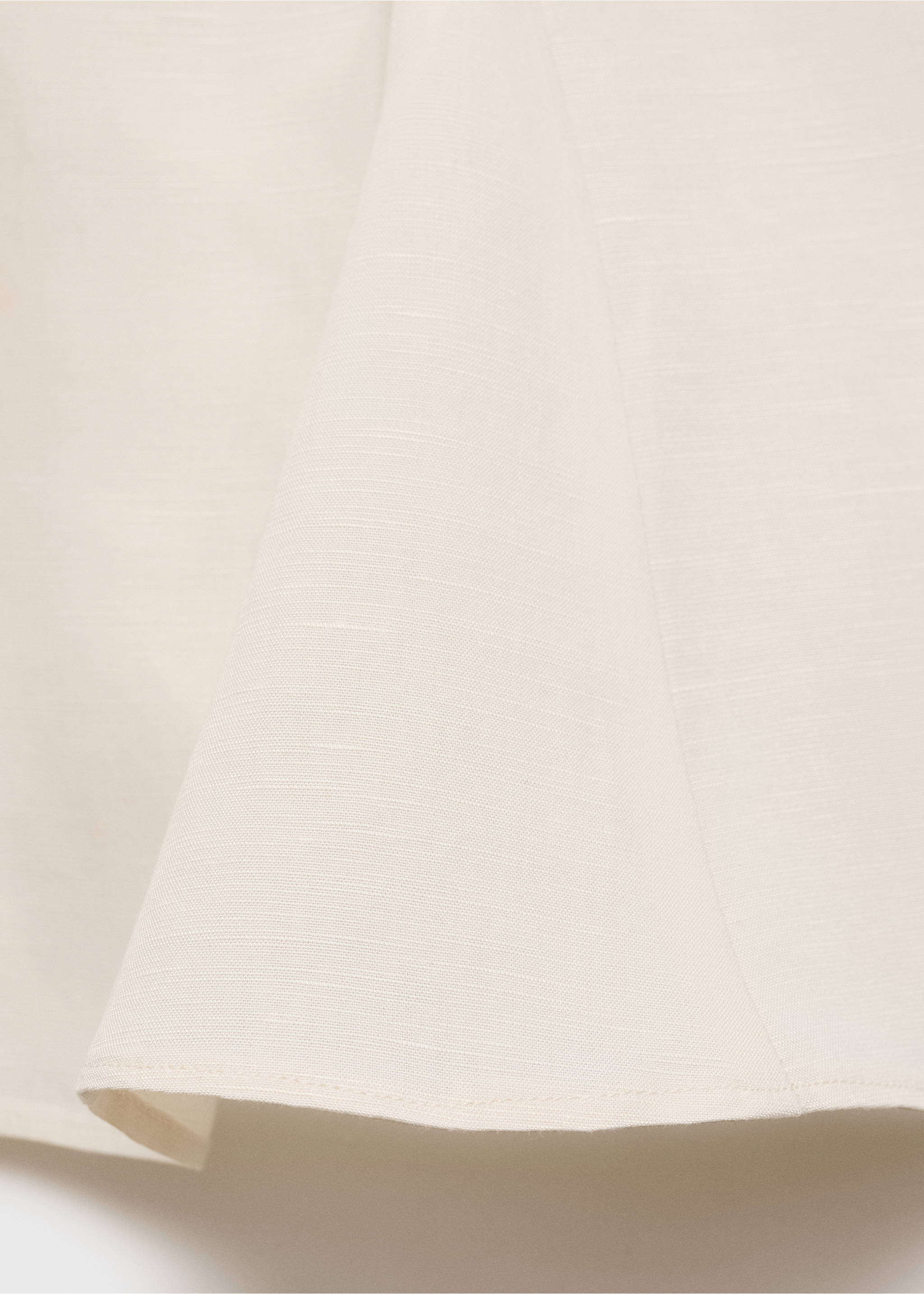 Close-up of the textured cream fabric of a top., Ecru. Ref: 87067179-00.