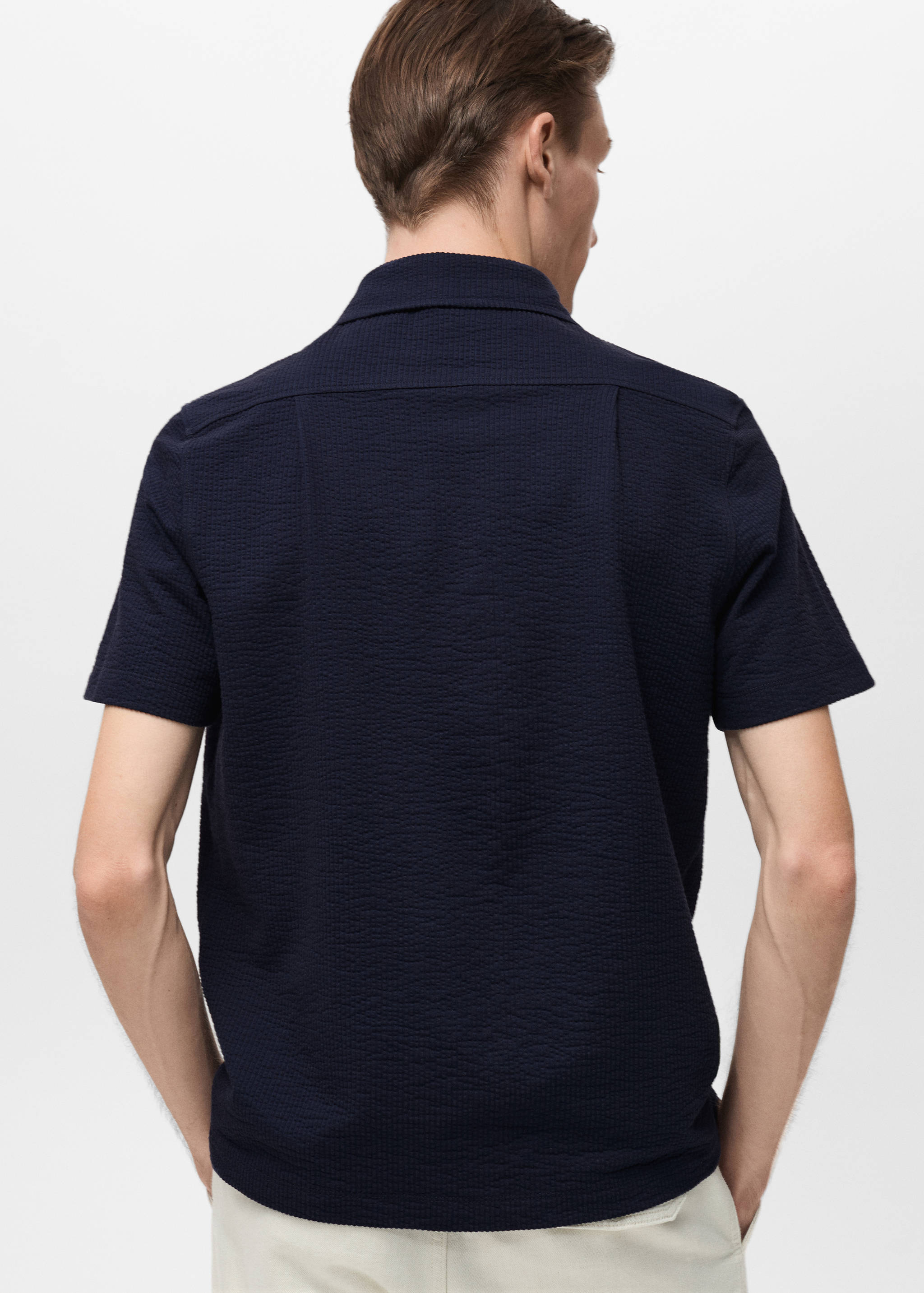 Seersucker katoenen poloshirt - Achterkant van het artikel