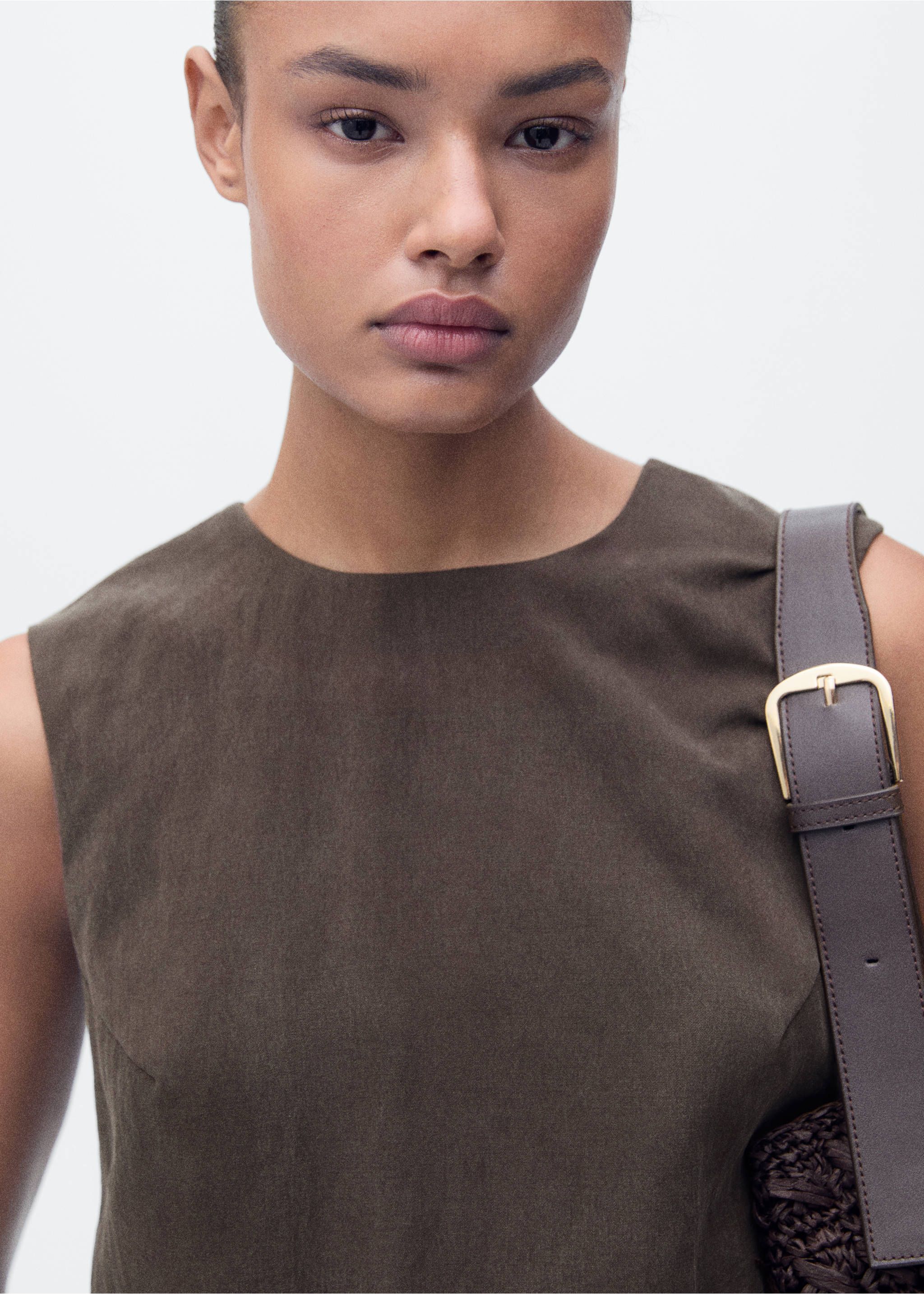 Olive green sleeveless top with a round neckline, shown in a close-up., Brown. Ref: 87068263-00.
