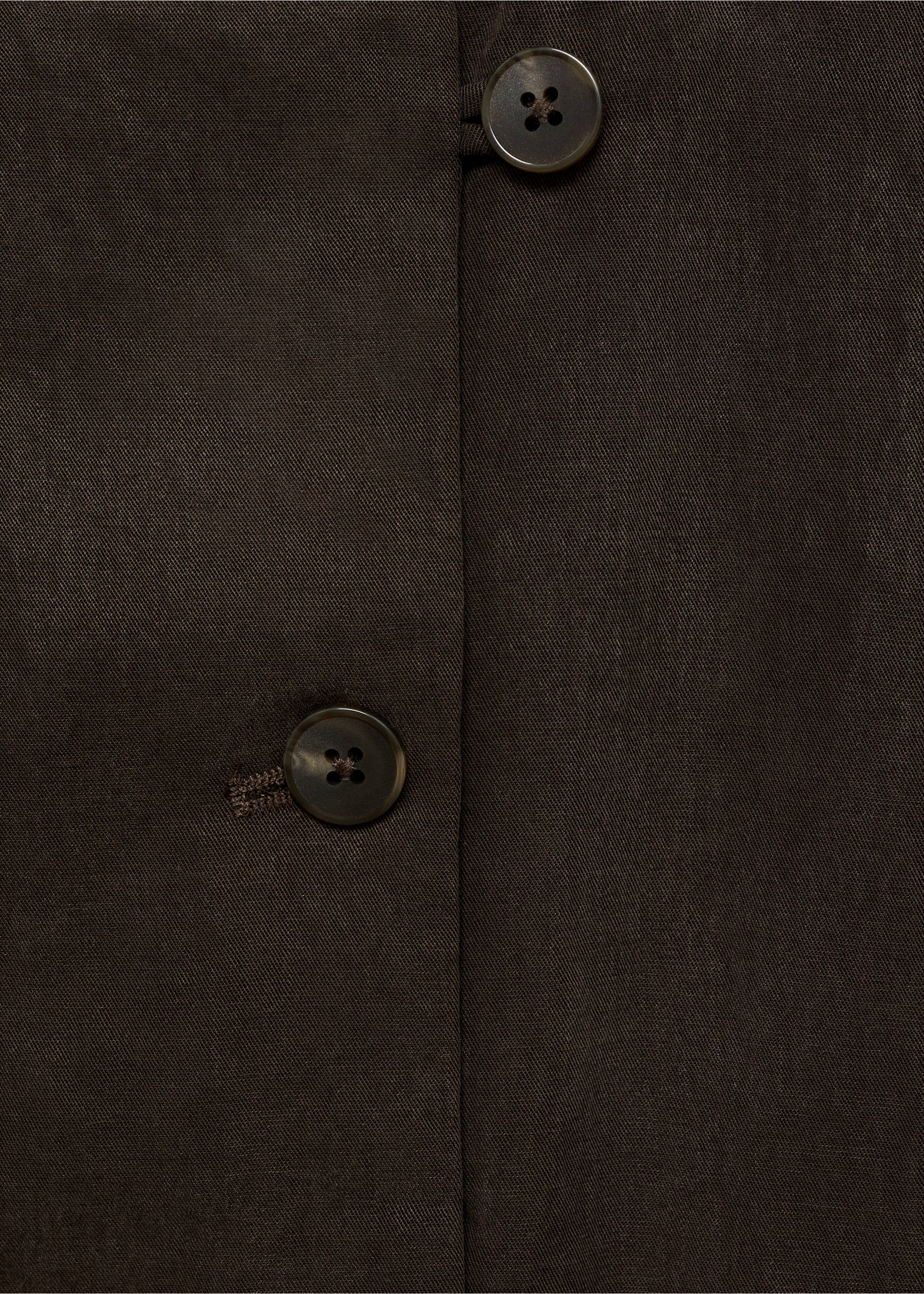Close-up of a dark brown top showing the fabric and button detail., Brown. Ref: 87068263-00.