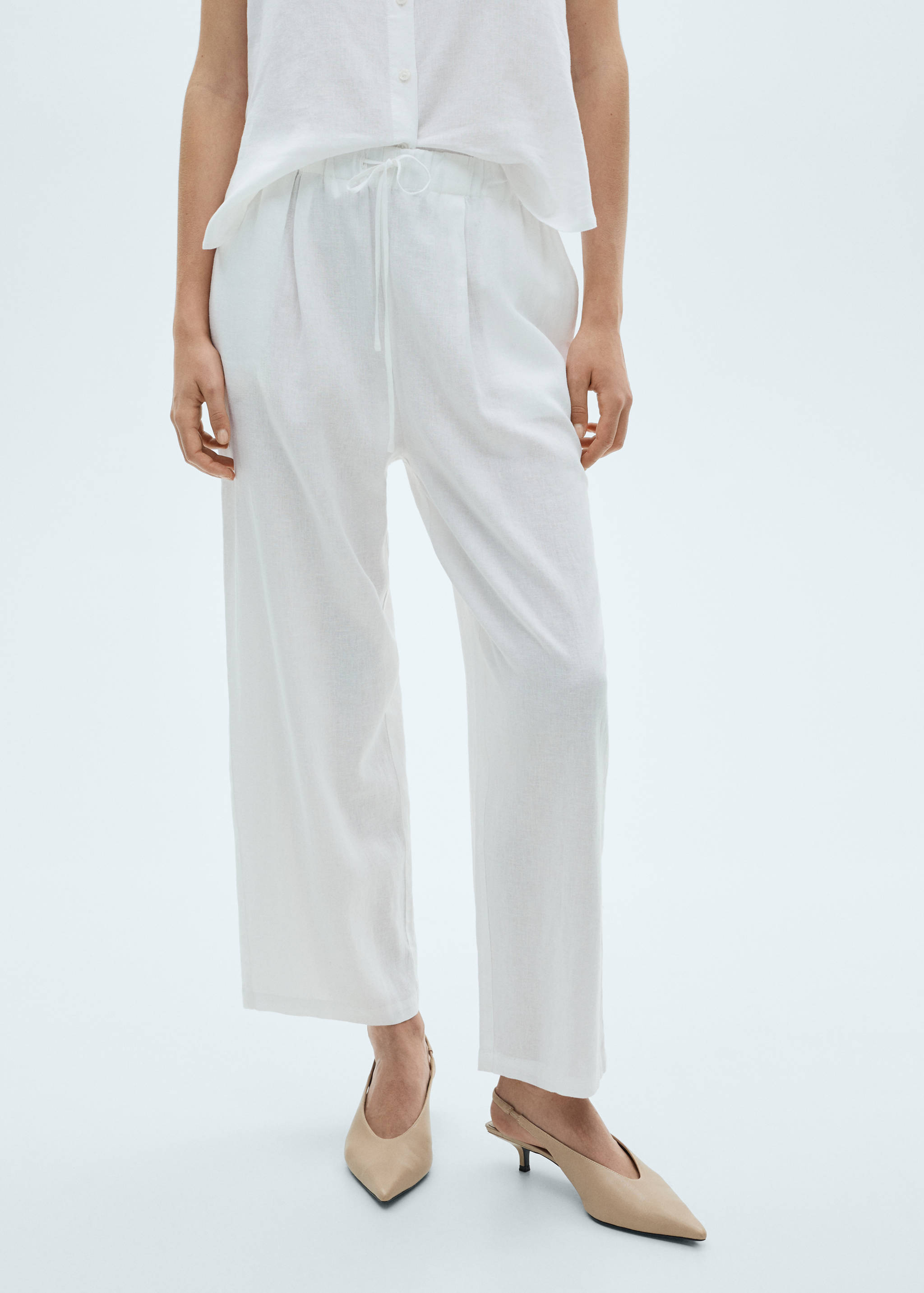 Flowing linen trousers - Reverse of the article