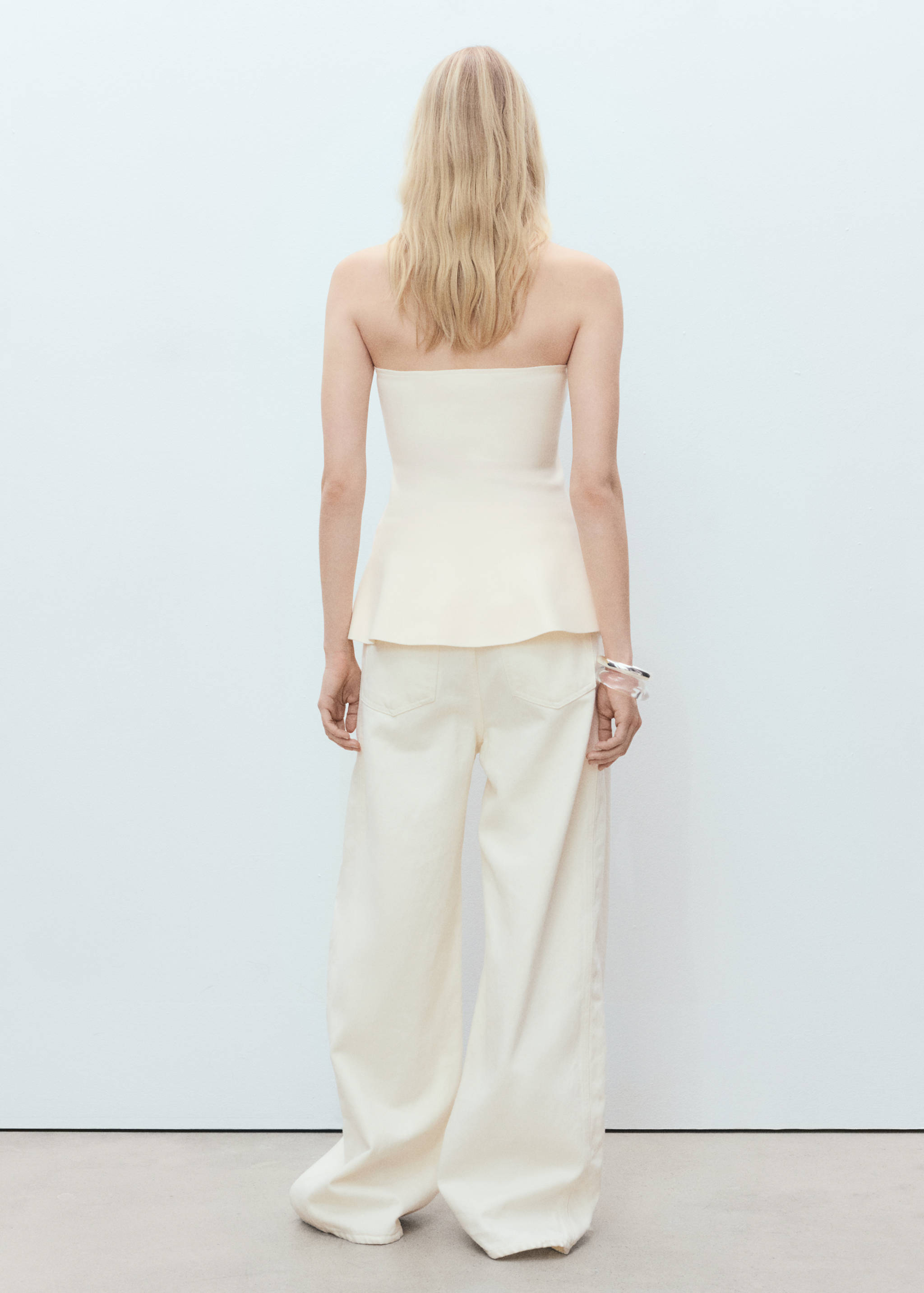 Strapless peplum top - Reverse of the article